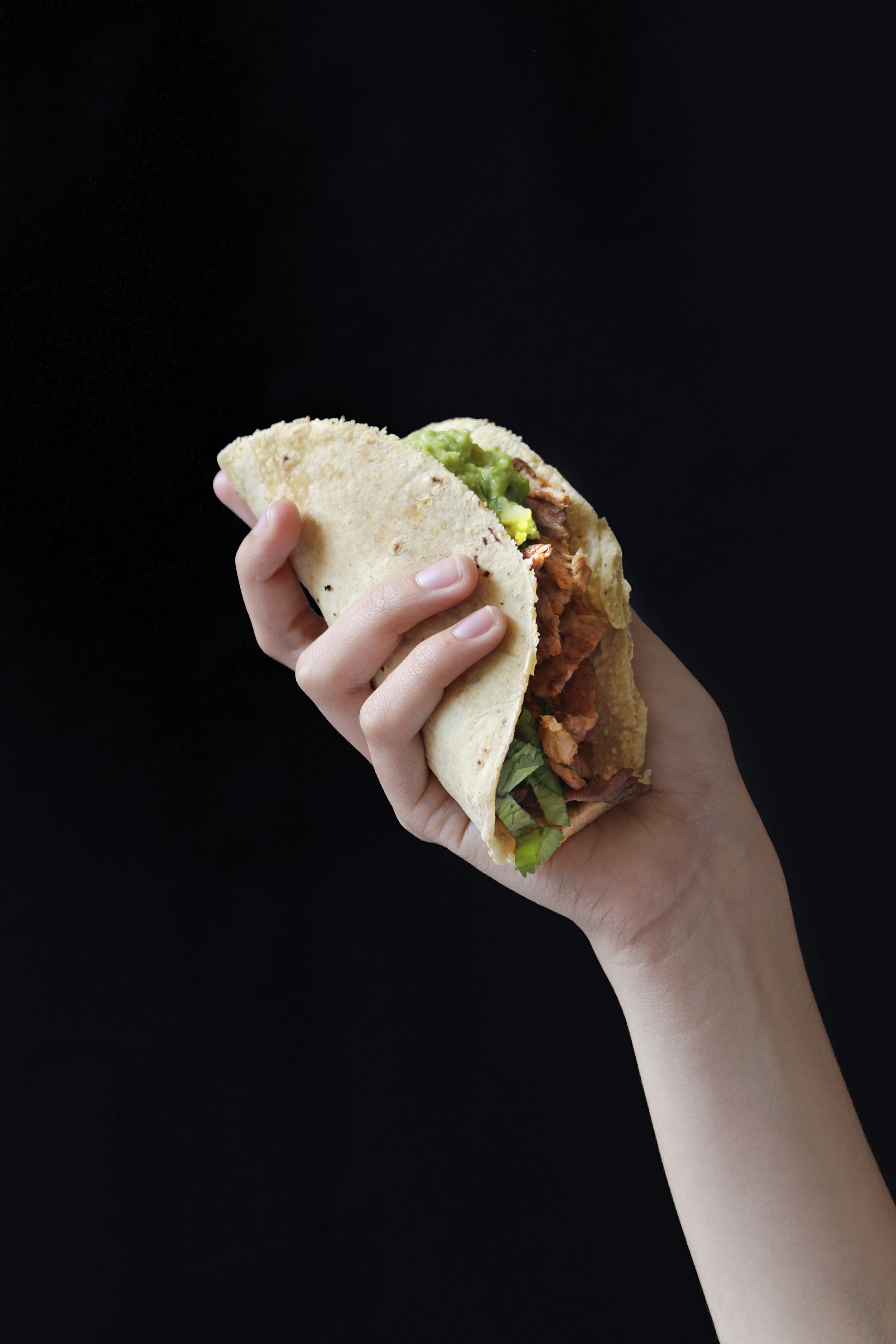 ready-to-eat, black background, cheeseburger, fast food, one person, meat, hand, holding, indoors, food and drink, bread, hungry, take out food, vegetable, Phone HD Wallpaper