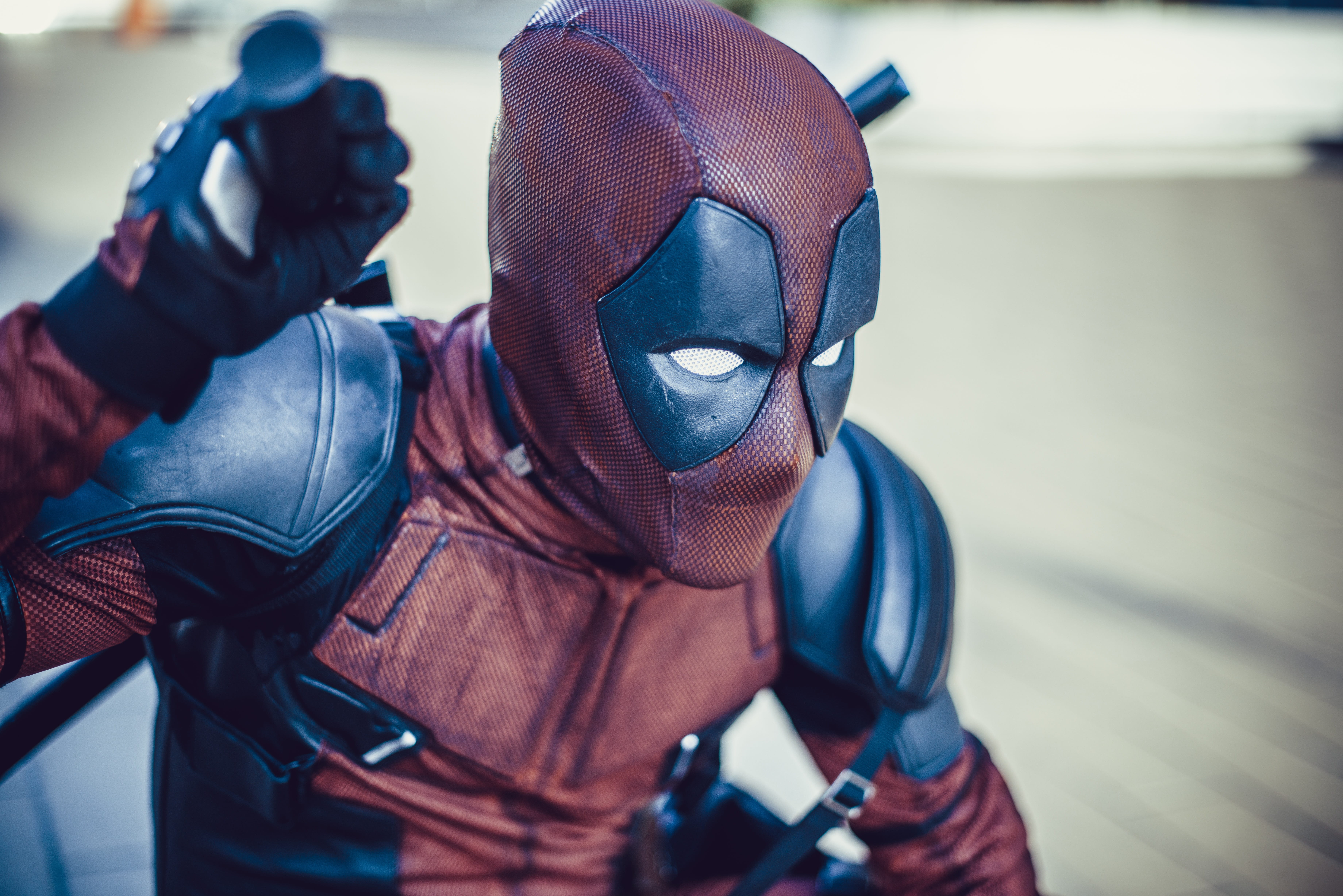deadpool, combat sport, lifestyles, holding, indoors, red, real people, close-up, character, focus on foreground, 5K, men, hollywood, cosplay, movie, costume, HD Wallpaper