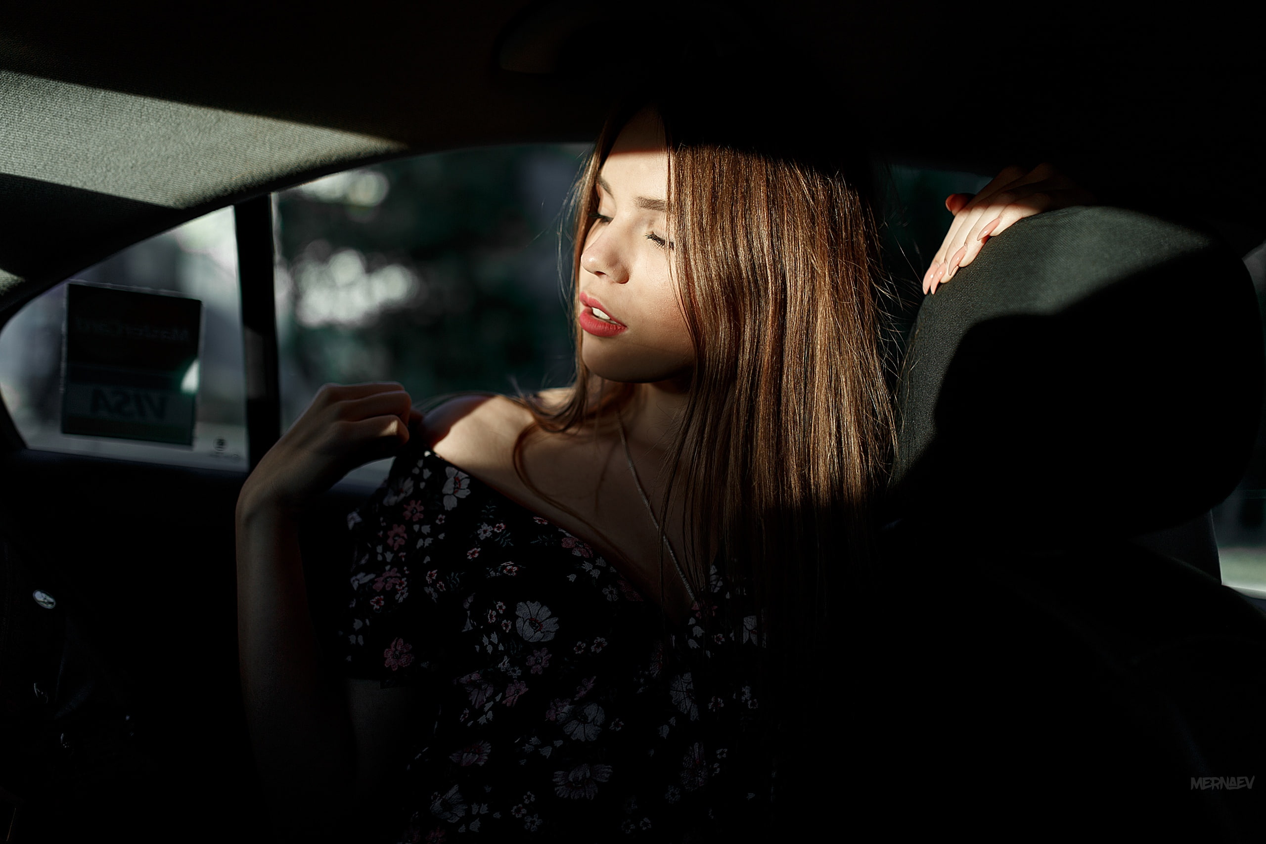 dress, Artyom Mernaev, closed eyes, sun rays, depth of field, vehicle interiors, painted nails, brunette, portrait, 2K, dark, inside a car, necklace, face, HD Wallpaper