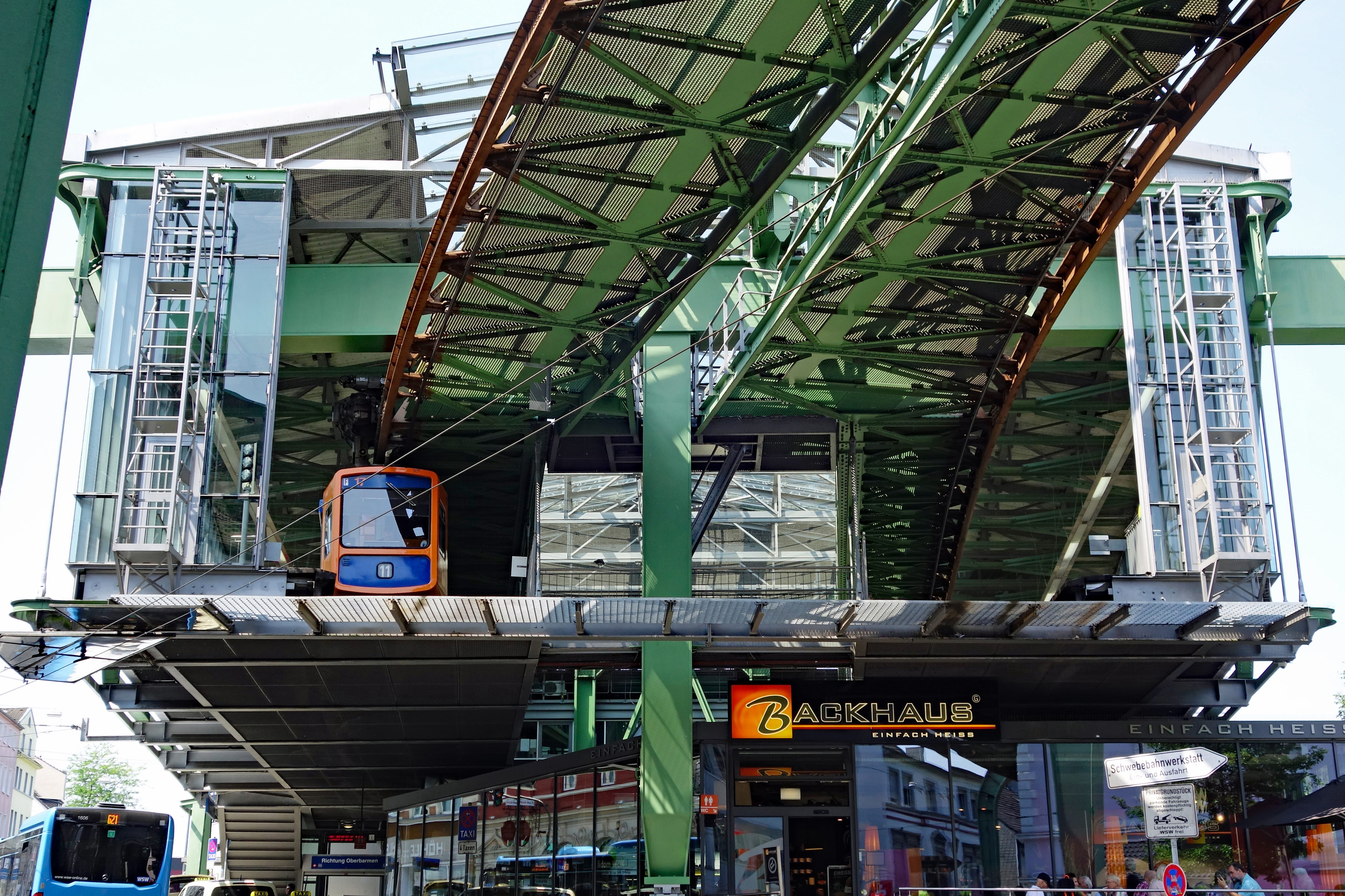 incidental people, text, built structure, terminus, railway depot, land vehicle, rail transportation, workshop, sign, monorail trains-to-depot, building exterior, HD Wallpaper