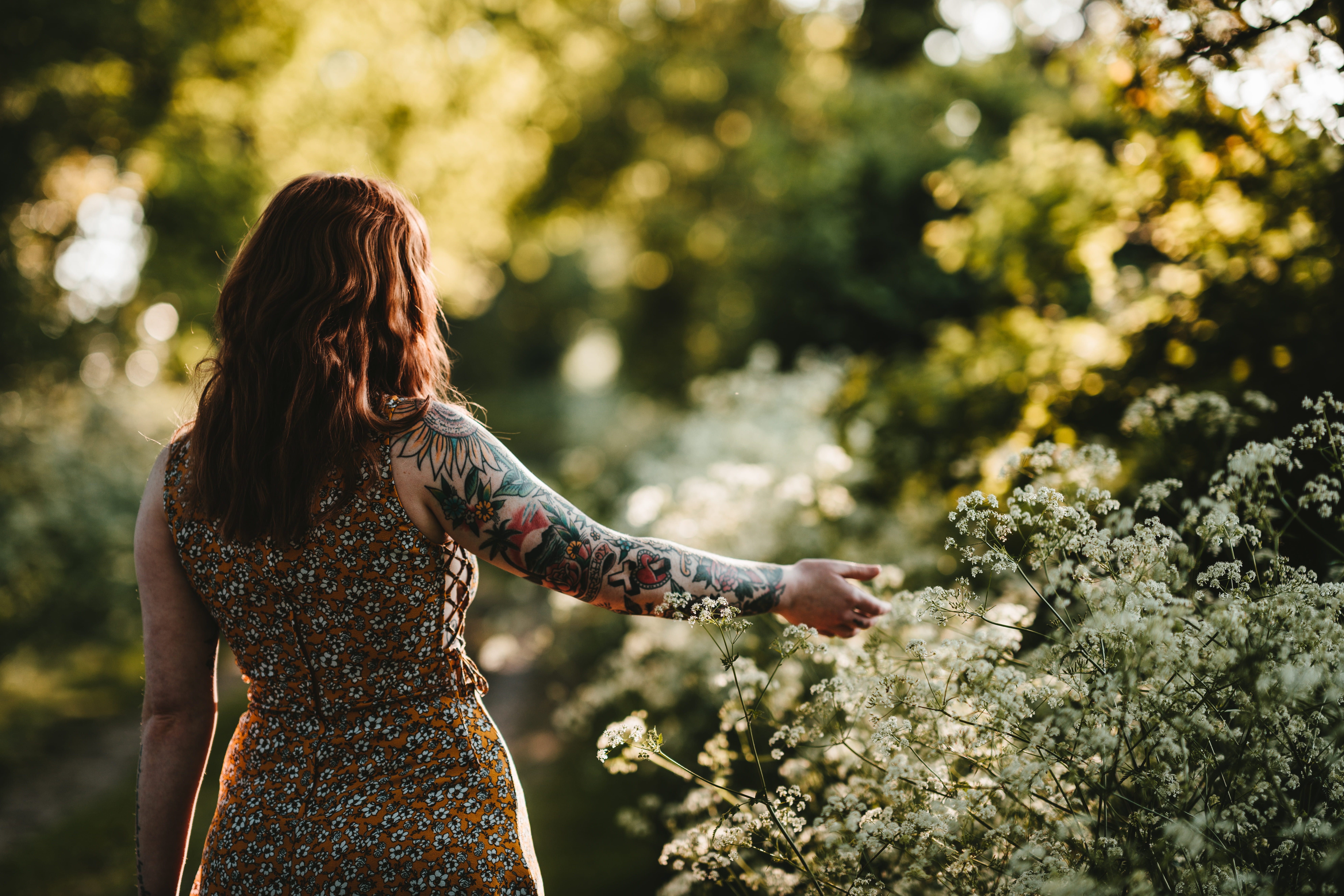 outdoors, dress, lifestyles, one person, tree, flower, red hair, tattoo, adult, summer, holding, hairstyle, growth, flowers, leisure activity, three quarter length, HD Wallpaper