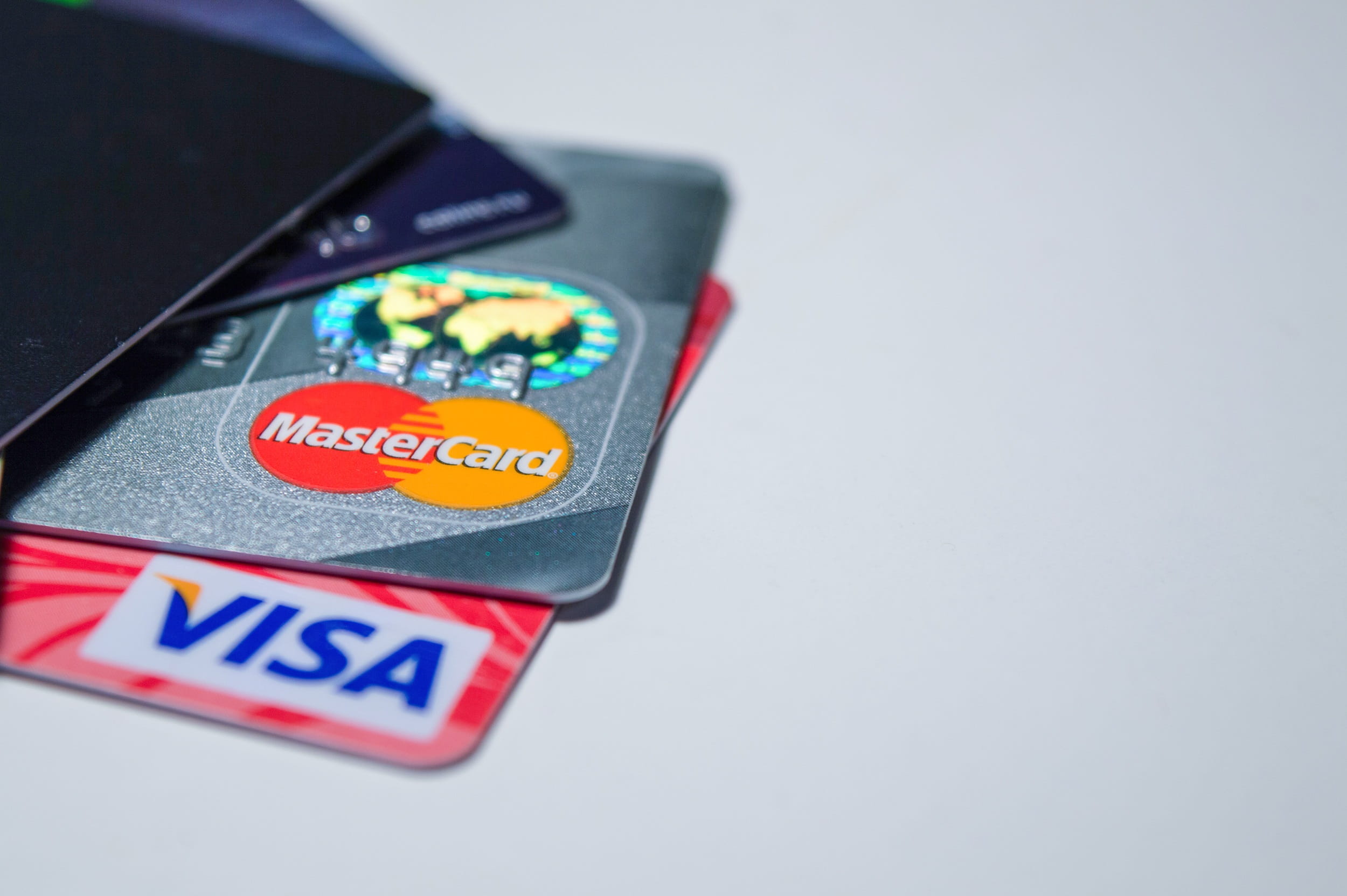 western script, copy space, security, single object, finances, plastic cards, communication, no people, Visa card, indoors, debit card, close-up, red, electronic payments, HD Wallpaper