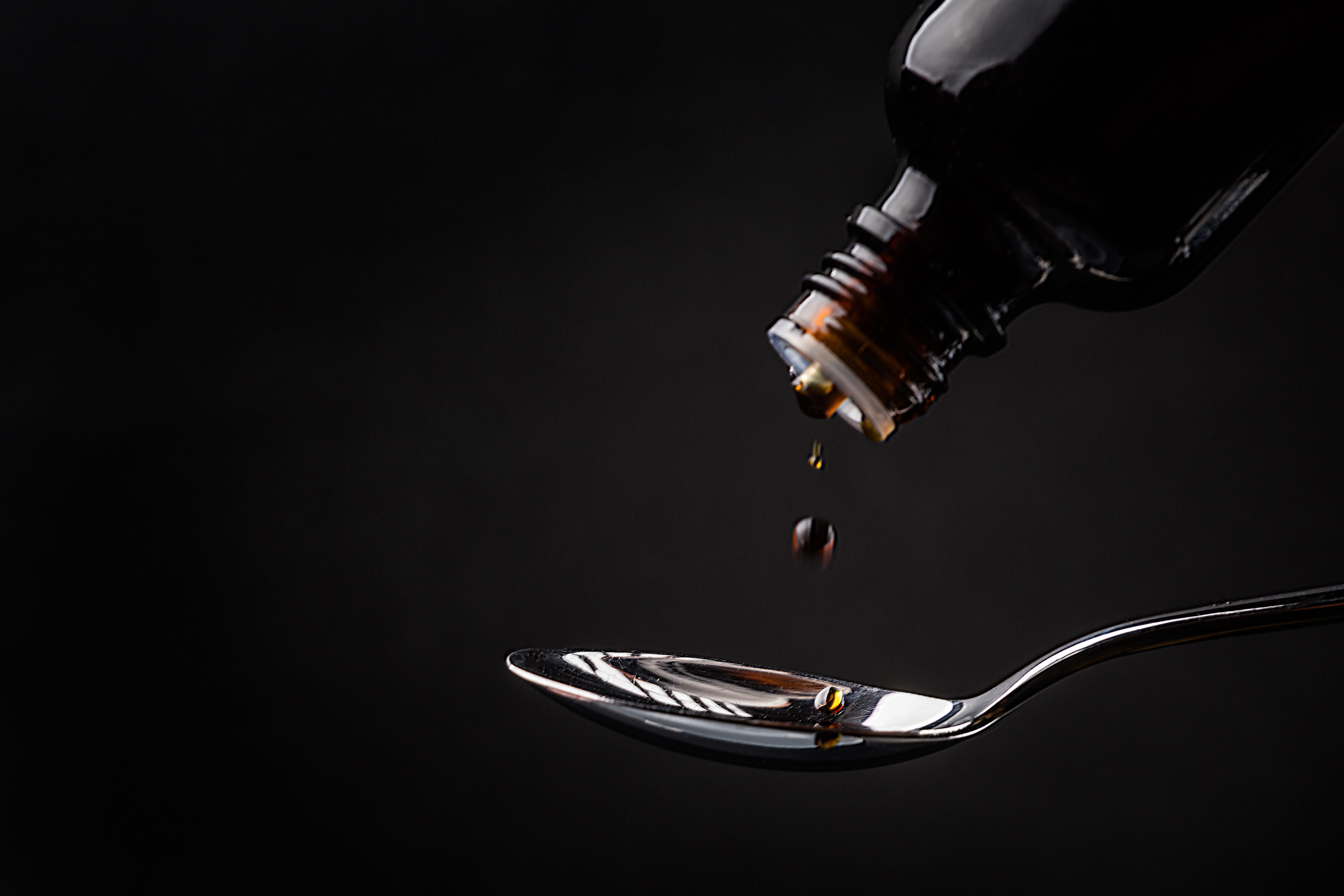 ill, spoon, medical, cough, close-up, black color, eating utensil, medicine, falling, black background, water, kitchen utensil, healthcare and medicine, HD Wallpaper