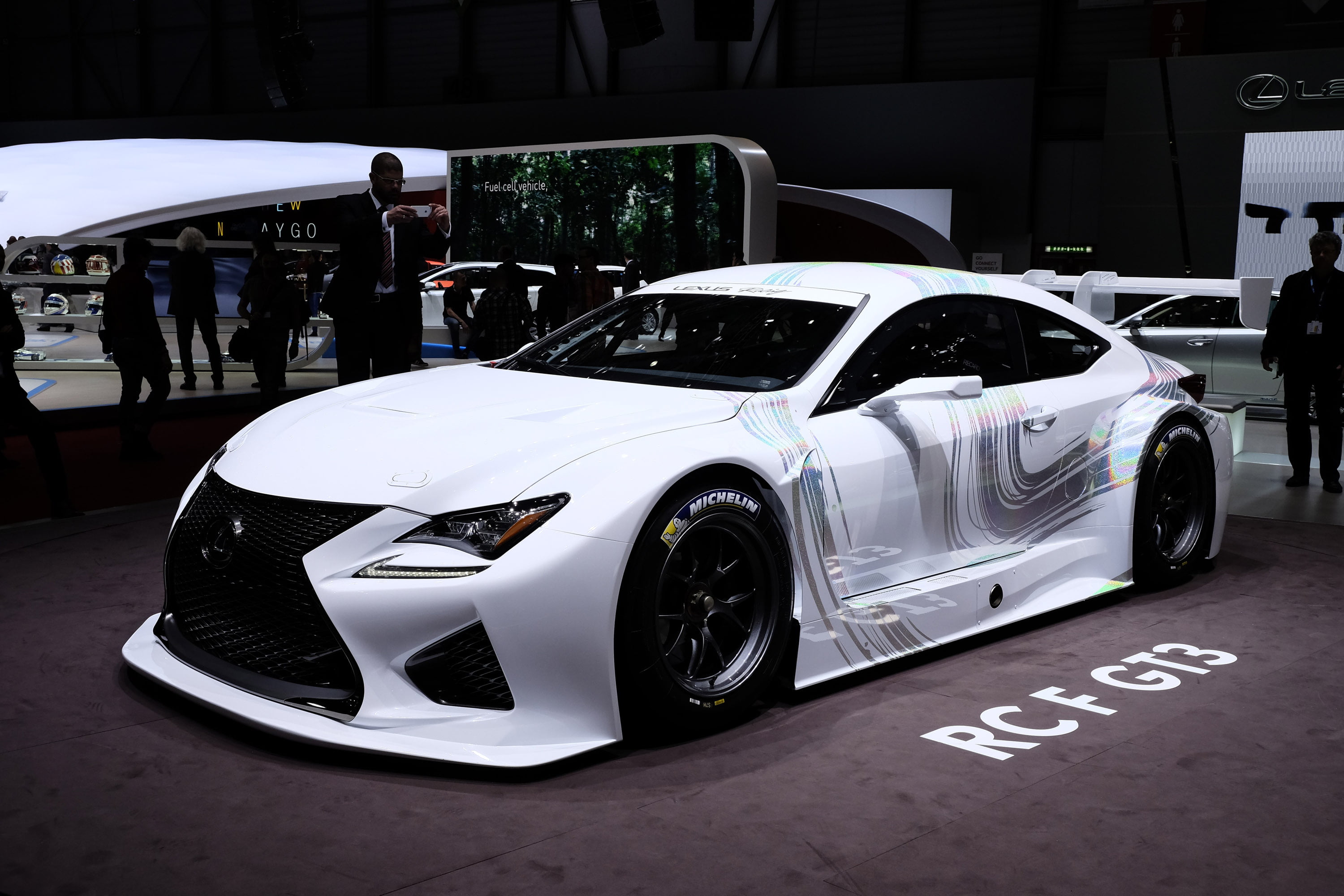 group of people, outdoors, racecar, motor vehicle, white, day, shiny, text, technology, men, power, design, exhibition, concept, incidental people, rcf, HD Wallpaper