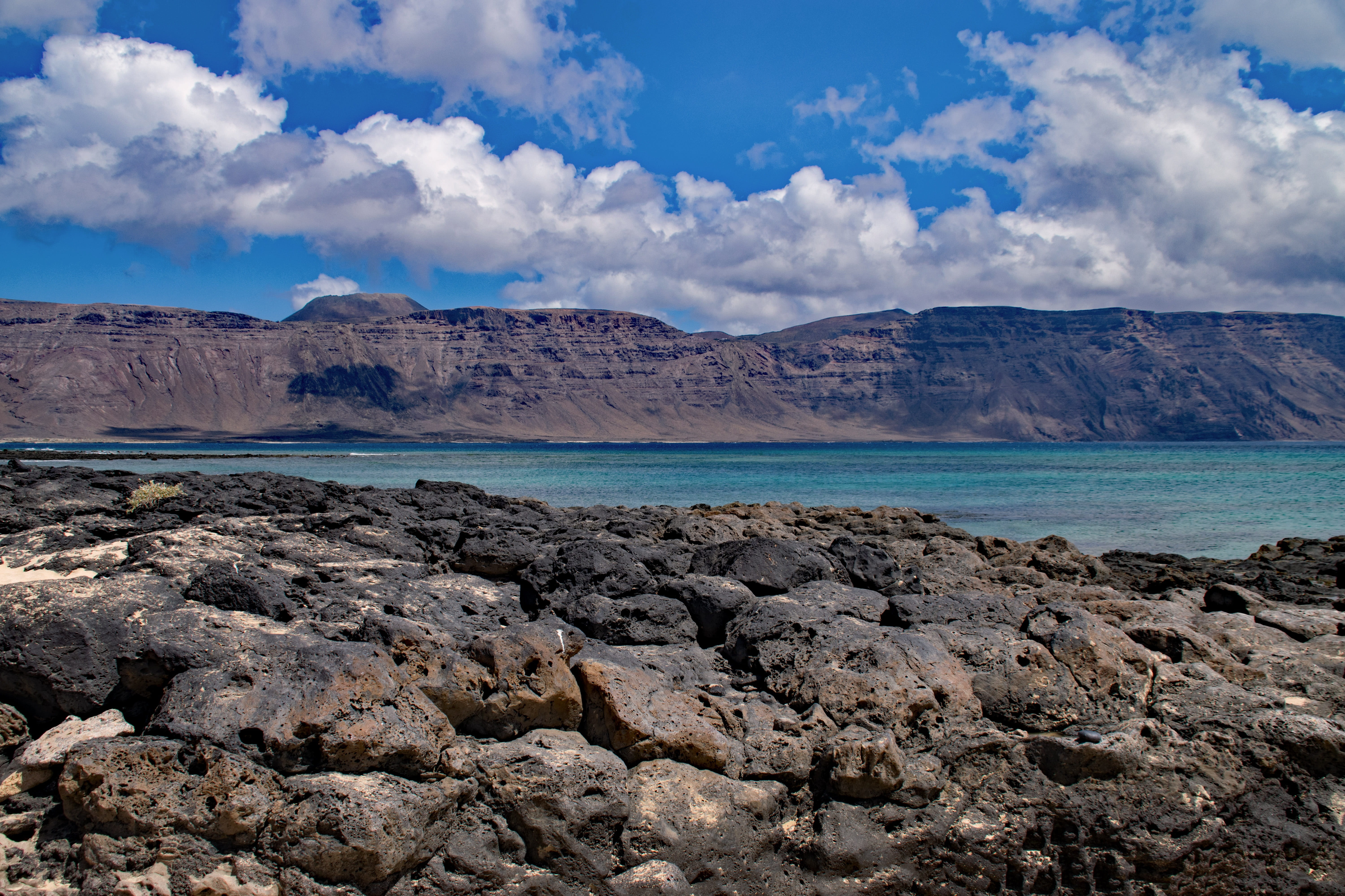 sea, spain, rock - Object, mountain range, canary islands, arid Climate, extreme Terrain, coast, non-urban scene, mountain, sky, la, volcano, scenics, solid, HD Wallpaper
