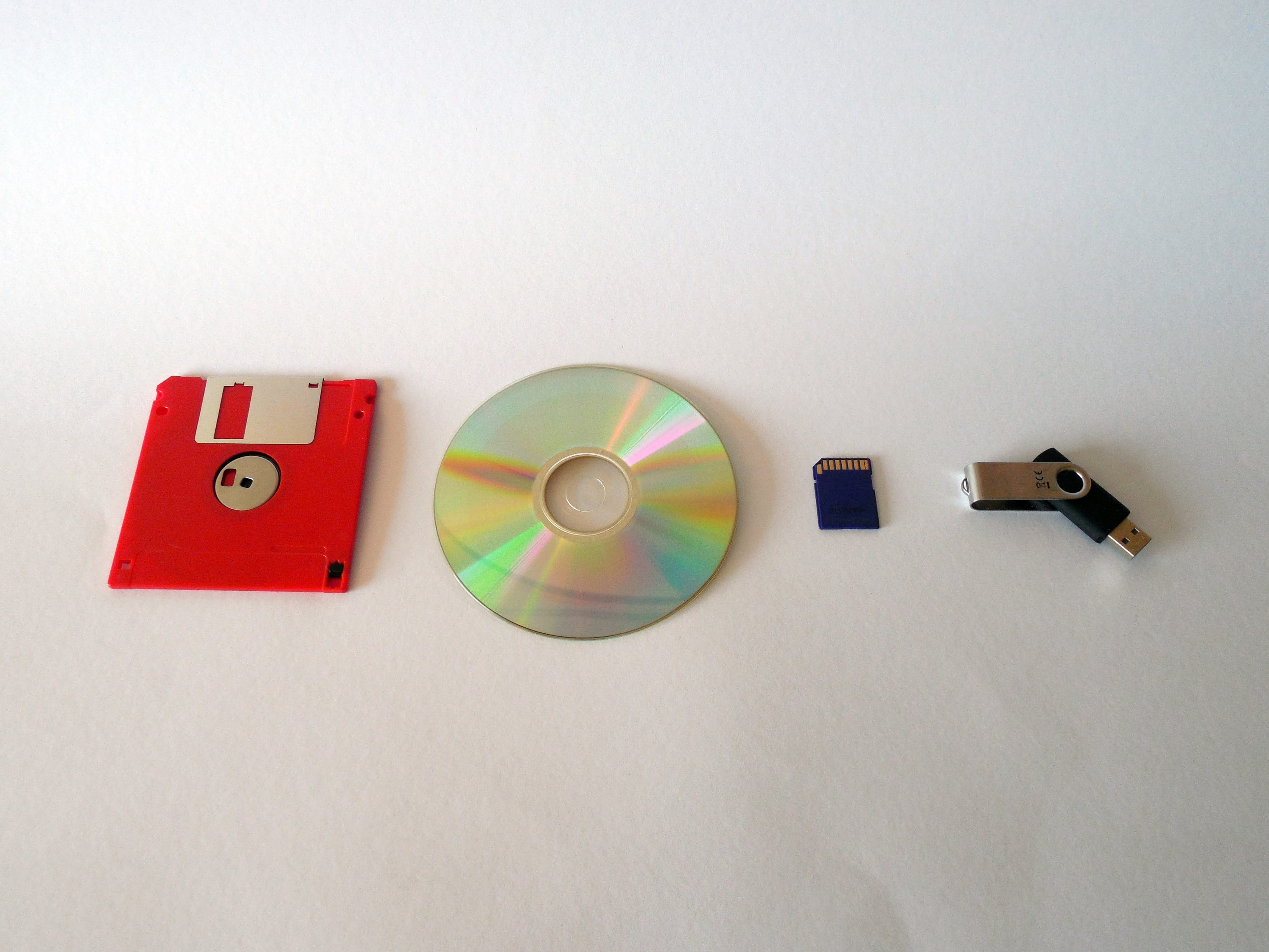 Data, white background, indoors, Floppy Disk, Usb, single Object, circle, geometric shape, home interior, disk, table, plastic, Cd, no people, Memory, close-up, HD Wallpaper