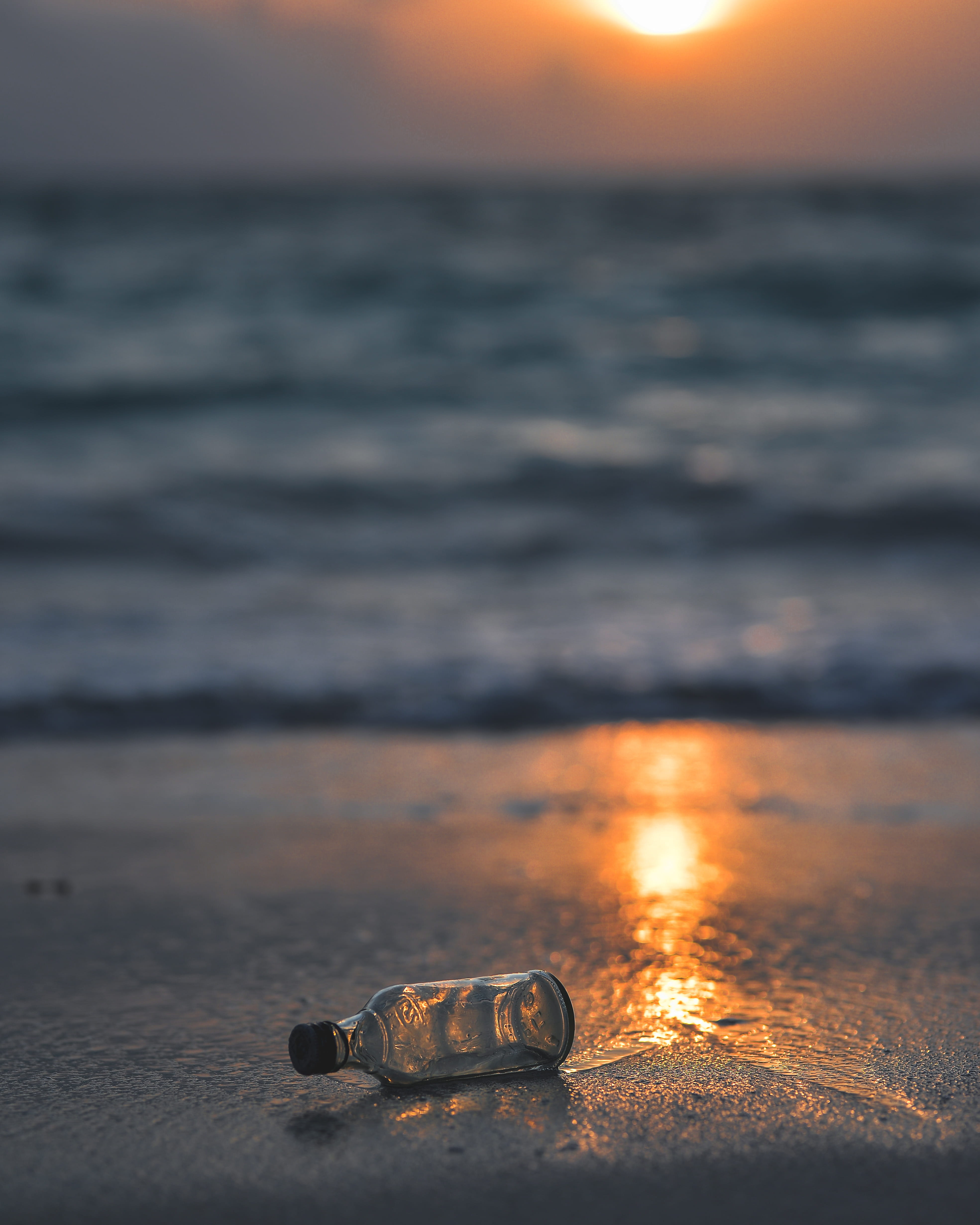 sky, drink, selective focus, bottle, beach, lowlight, ocean, focus on foreground, sunset, clear, orange color, seashore, peaceful, beverage, glass, sea, Phone HD Wallpaper