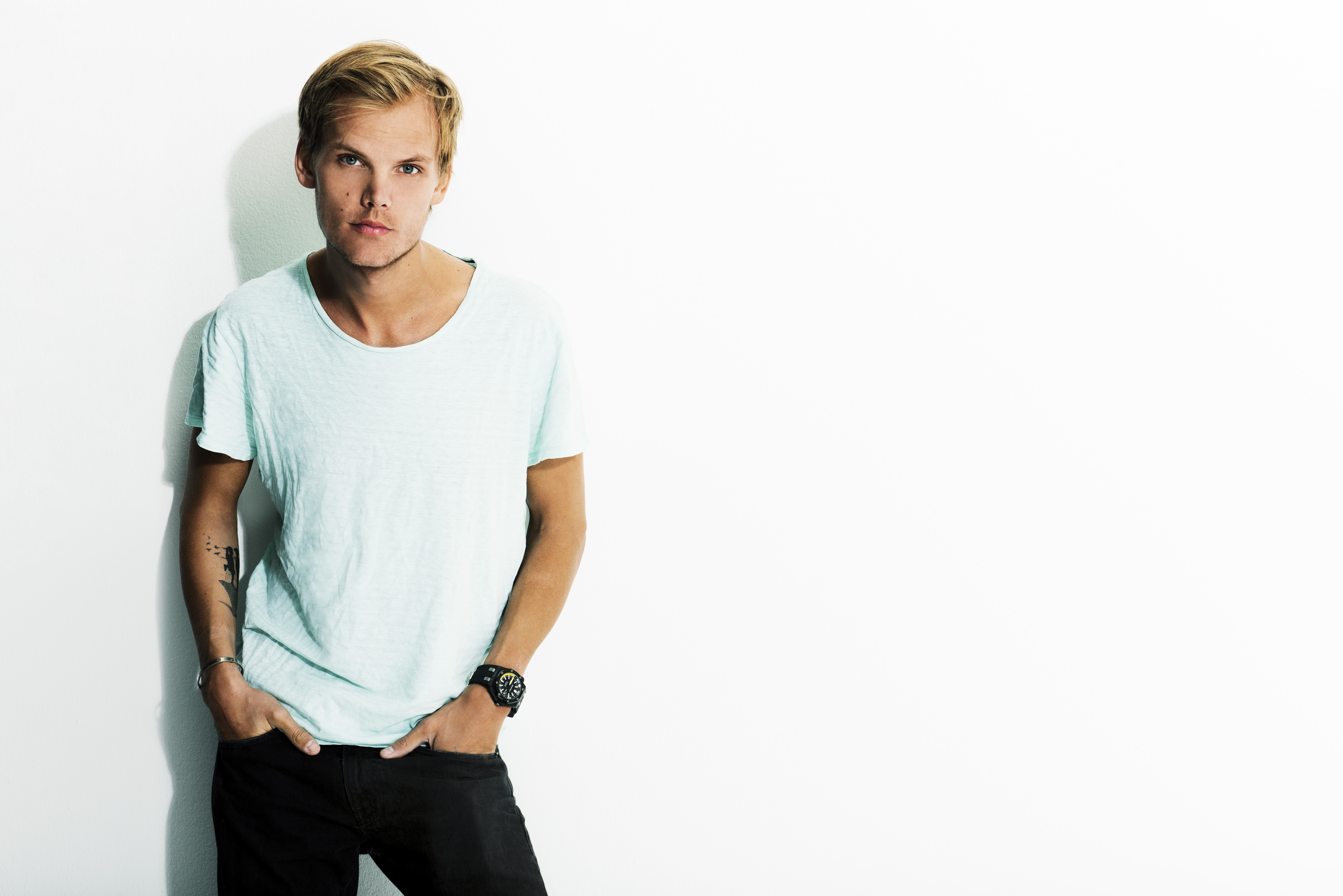 Avicii, indoors, portrait, DJ, young adult, T-shirt, front view, musician, studio shot, looking at camera, one person, confidence, looking, young men, standing, HD Wallpaper