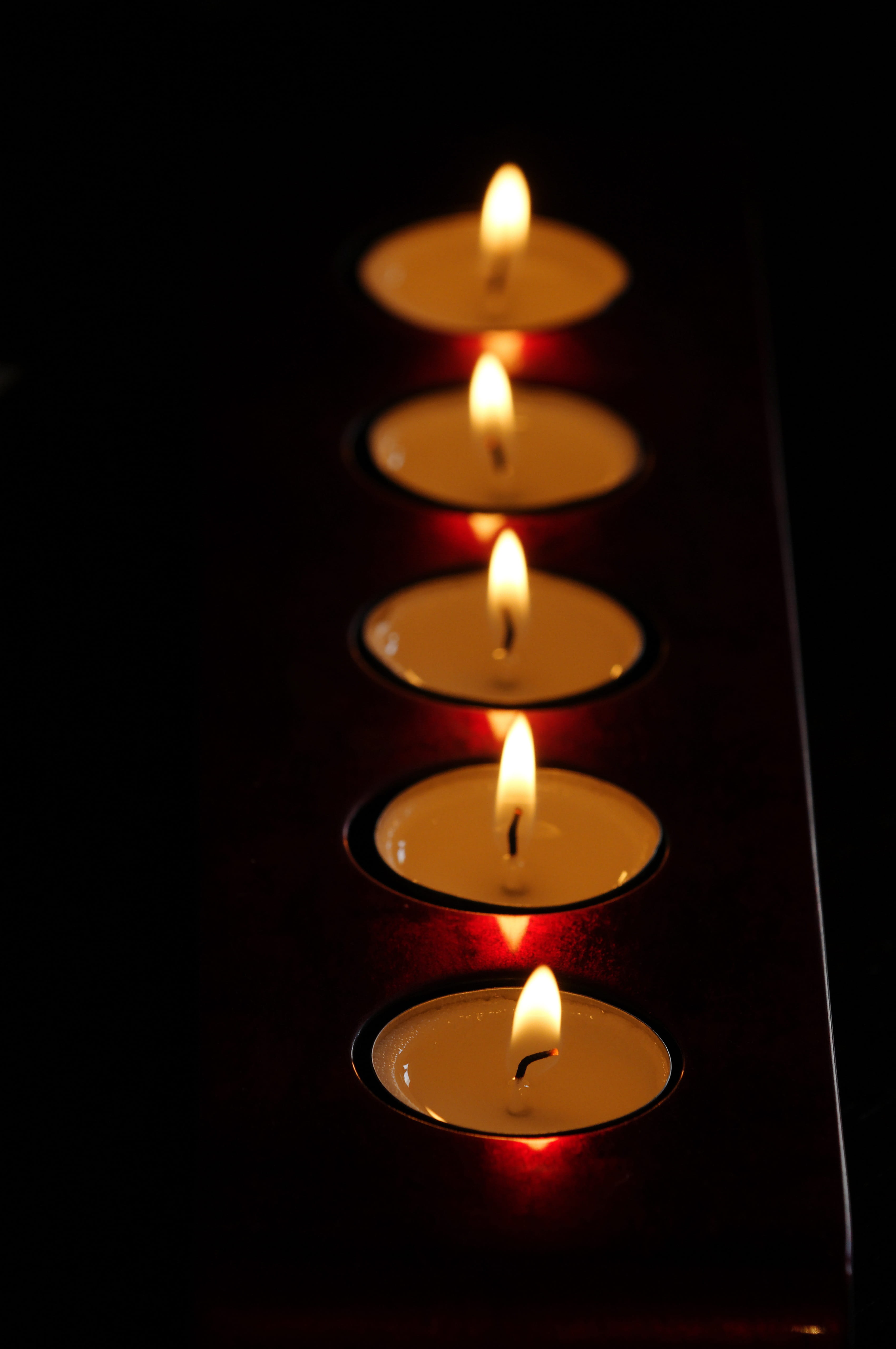 close-up, nature, illuminated, celebration, glowing, festive, Fire, Tradition, church, in a row, black background, burning, wax, no people, fire - Natural Phenomenon, Phone HD Wallpaper