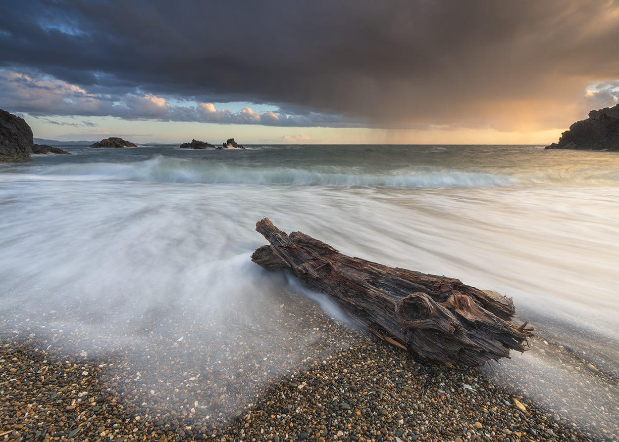 Beached, sea  waves, cloud, 480P, sea, coast, nature, driftwood, water, coastline, cloudscape, pebbles, long exposure, wave, Ynys Mon, LE, log, sky, beach, HD Wallpaper