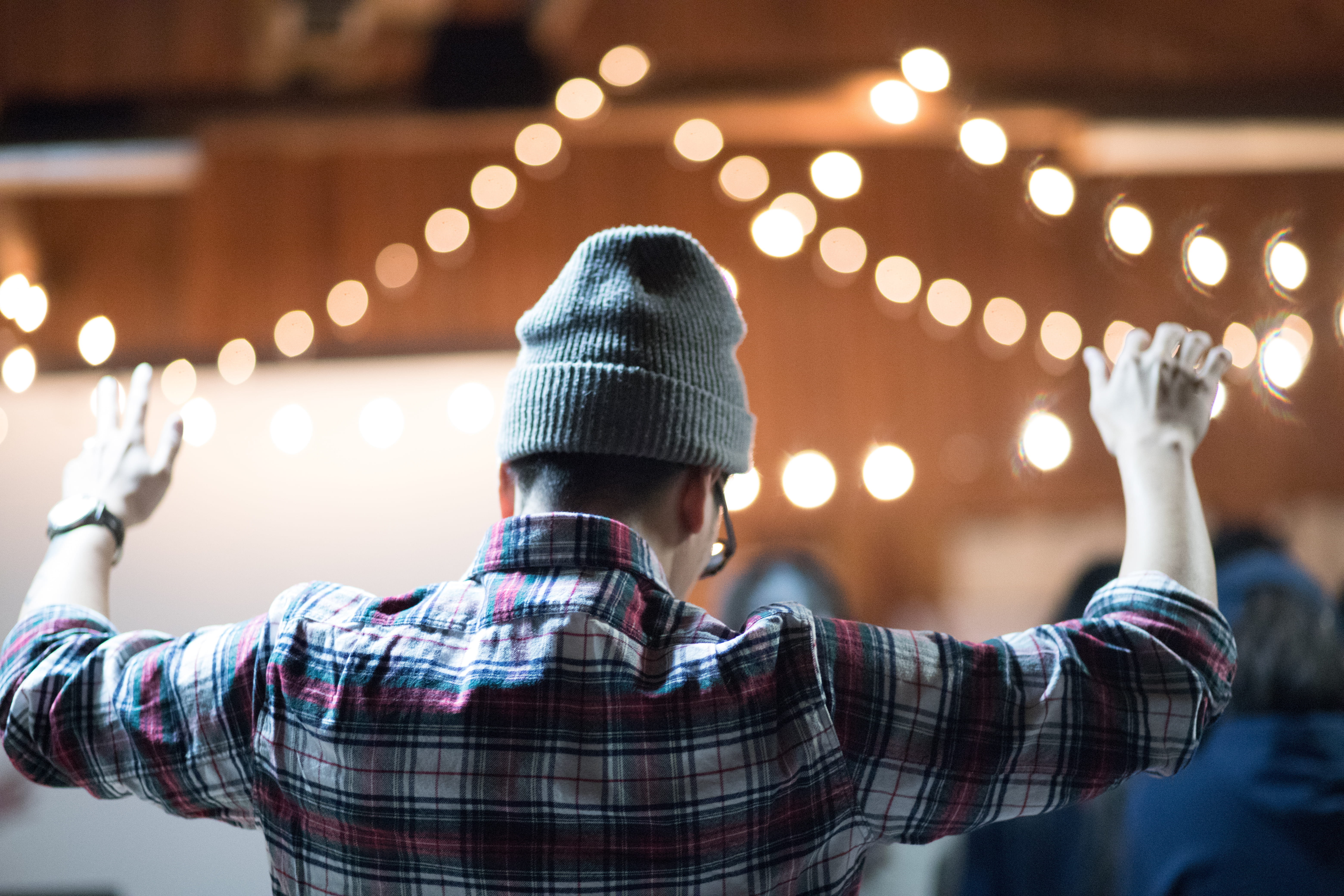 lifestyles, worship, warm clothing, knit hat, hat, rear view, lights, indoors, real people, celebration, illuminated, focus on foreground, human arm, 5K, HD Wallpaper
