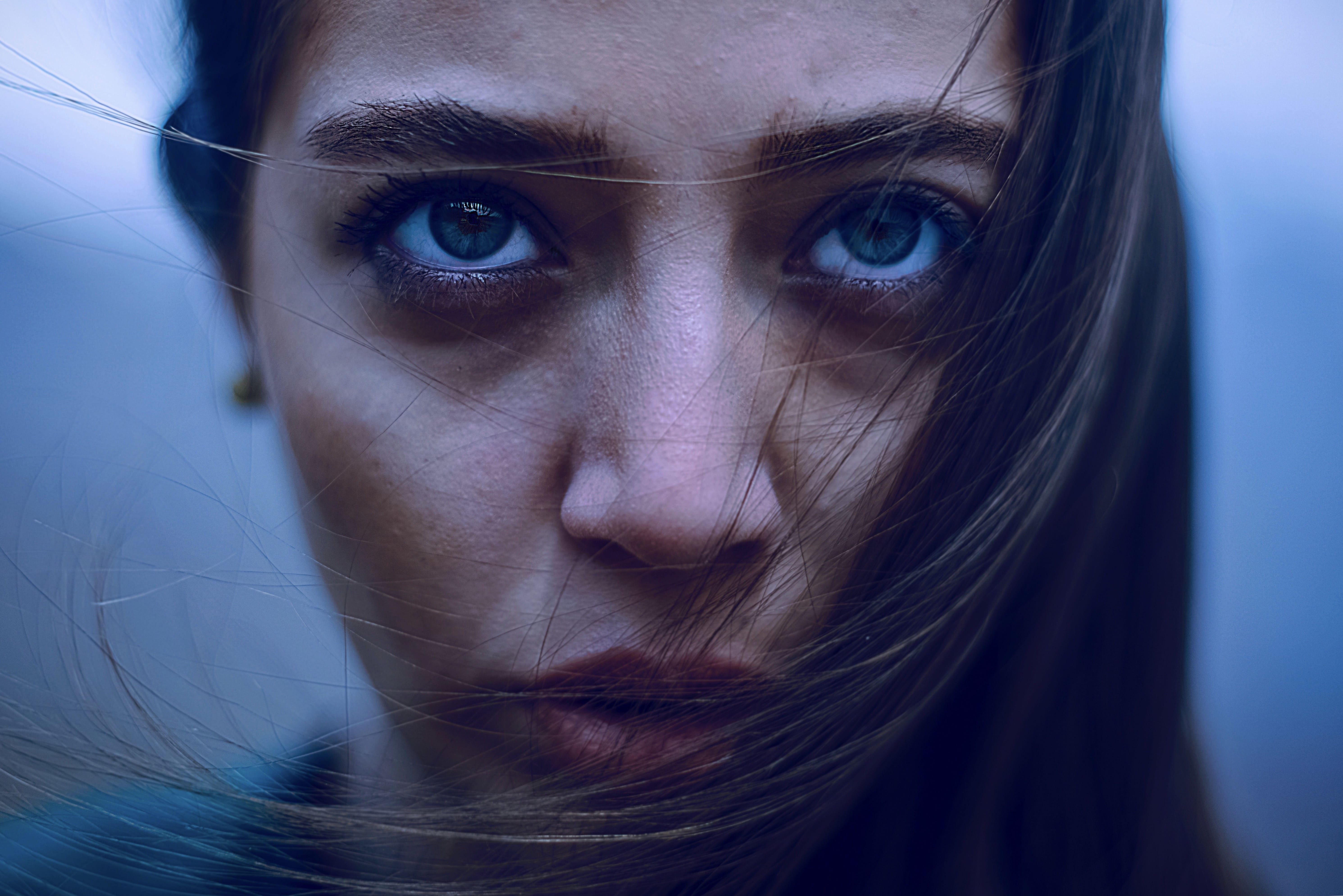 blue background, beauty, blue eyes, close-up, closeup, female, hairstyle, eye, looking at camera, blur, dark, adult, one person, headshot, intense, young women, HD Wallpaper