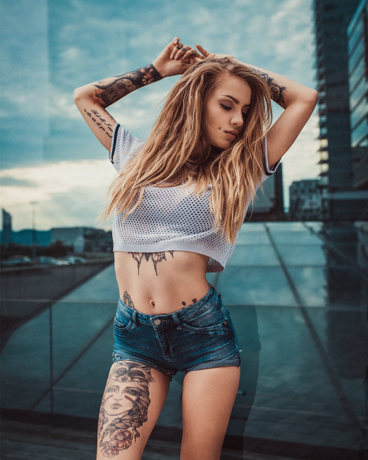 brunette, outdoors, women, model, skinny, crop top, pierced cheeks, inked girls, belly, women outdoors, jean shorts, 720P, tattoo, portrait display, glass, Phone HD Wallpaper