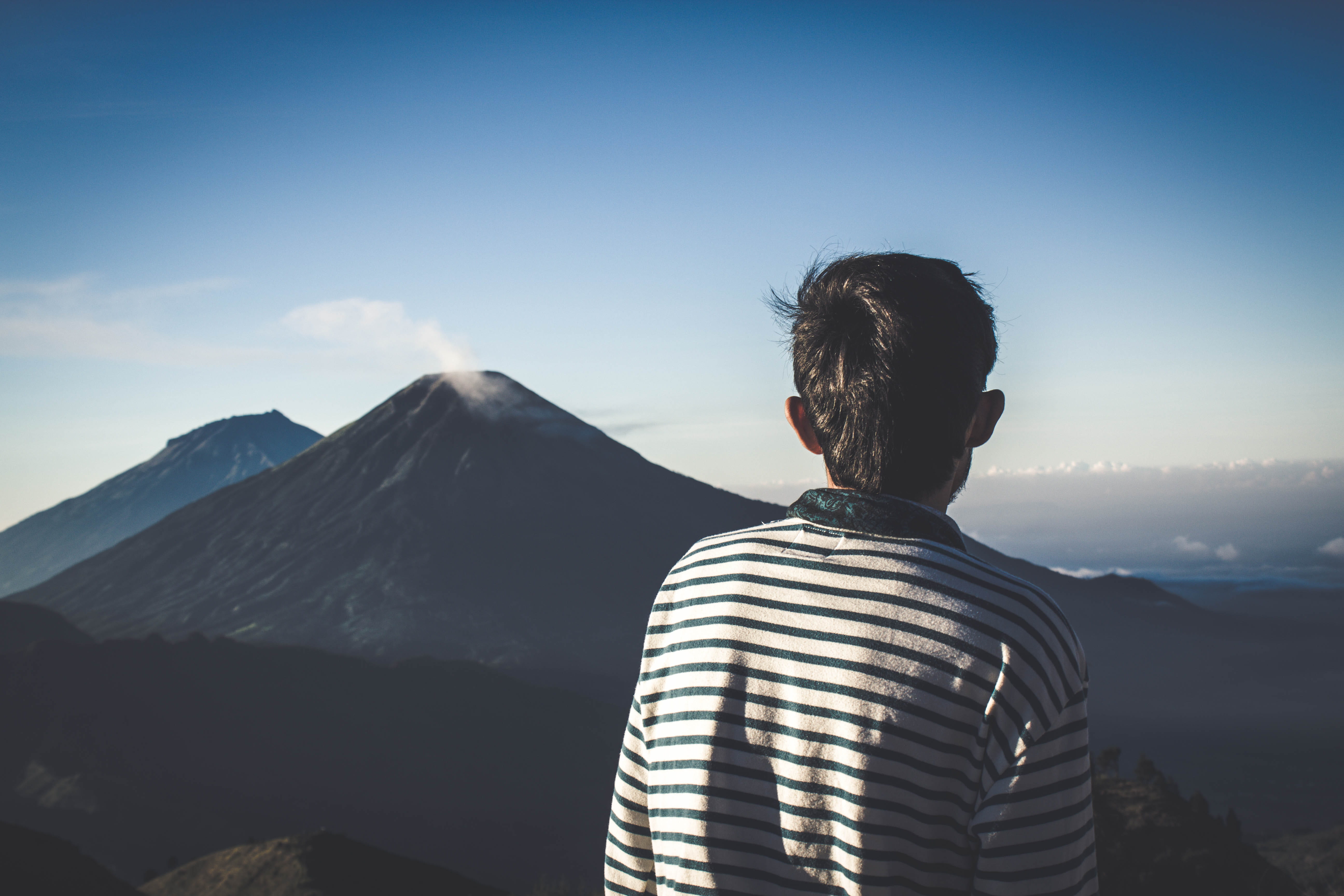 5K, rear view, volcano, daylight, real people, hairstyle, man, tranquility, nature, mountain, adventure, day, outdoors, scenics - nature, one person, looking at view, HD Wallpaper