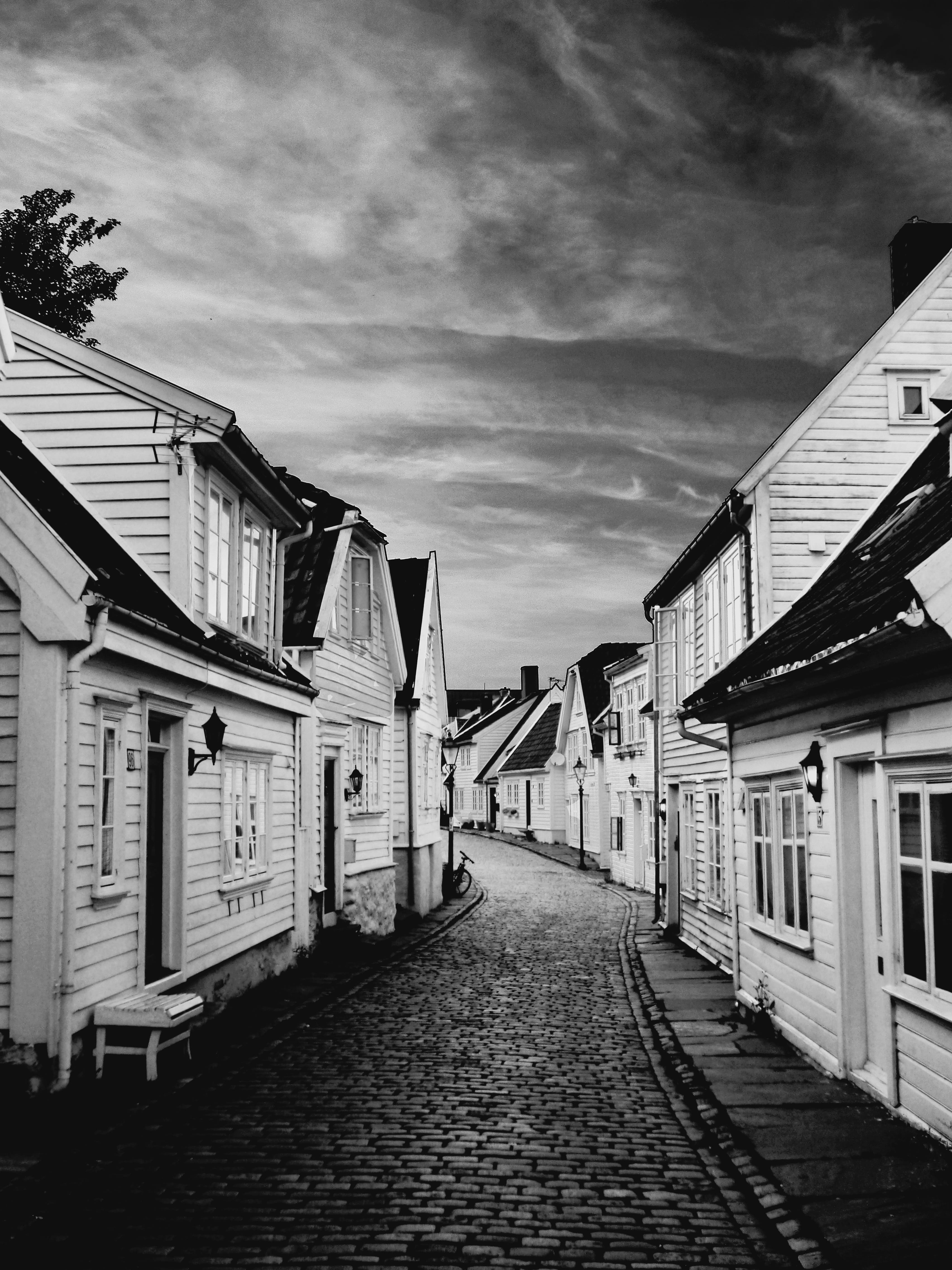 building Exterior, alley, buildings, city, sky, Norway, gloomy, cityscape, Old Town, exterior, diminishing perspective, long, black And White, wooden, nature, Phone HD Wallpaper