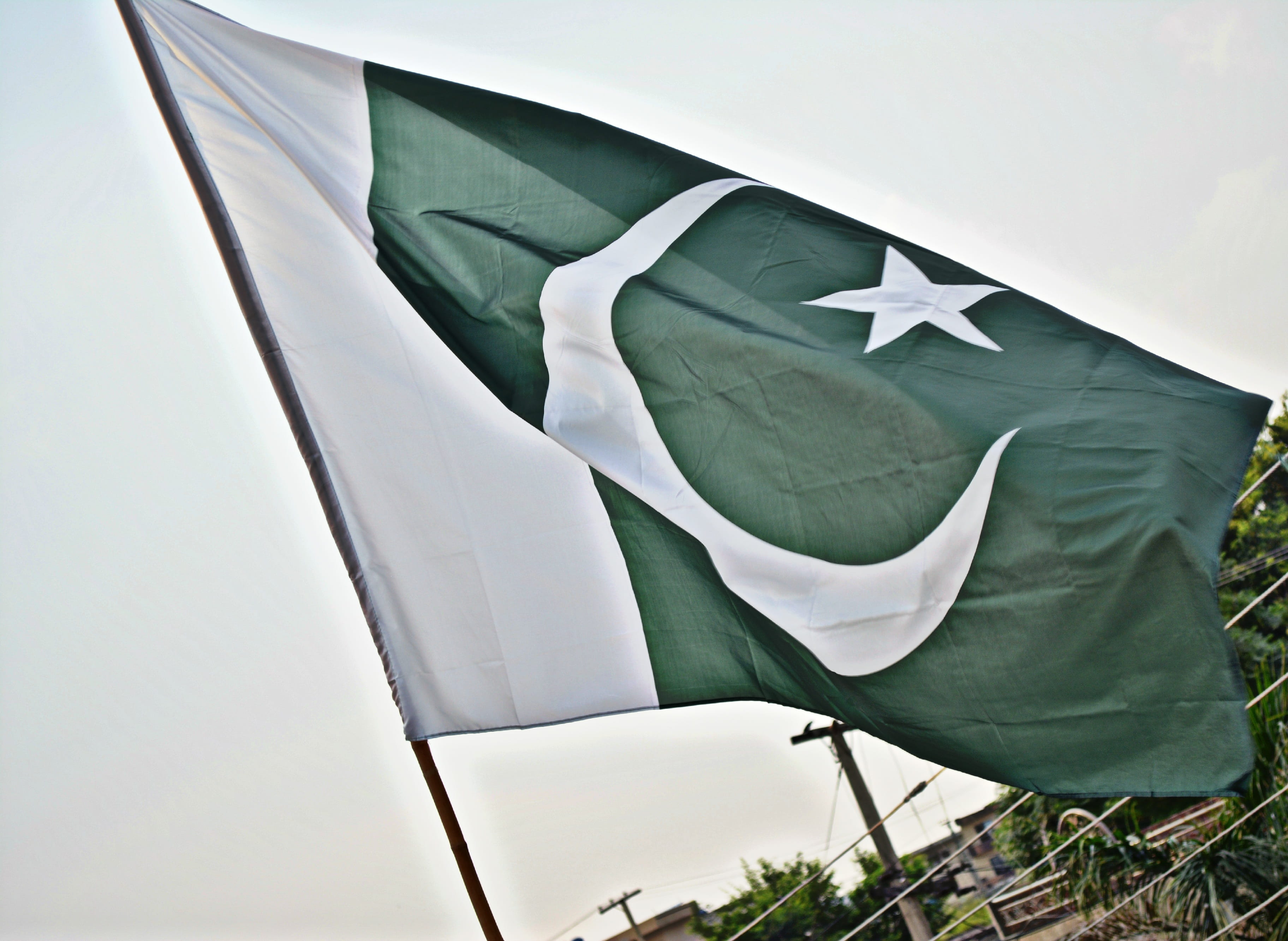 patriotism, wind, one person, National, close-up, green color, emotion, 2K, one man only, outdoors, Pakistan, day, shape, waving, textile, nature, sky, HD Wallpaper
