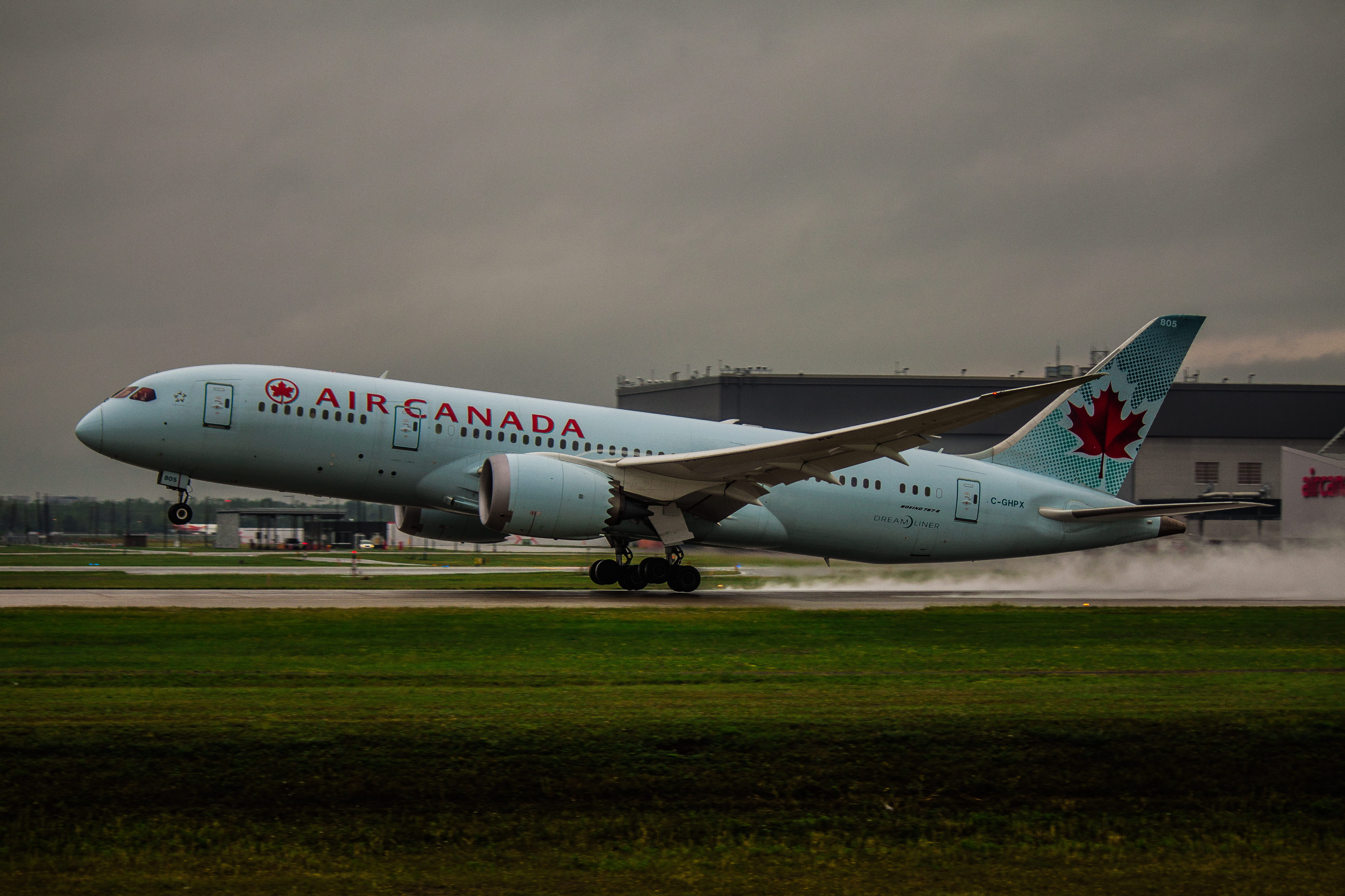aerospace industry, airliner, tarmac, nature, canada, no people, stationary, transportation, technology, sky, runway, arrival, dark clouds, field, aircraft wing, HD Wallpaper