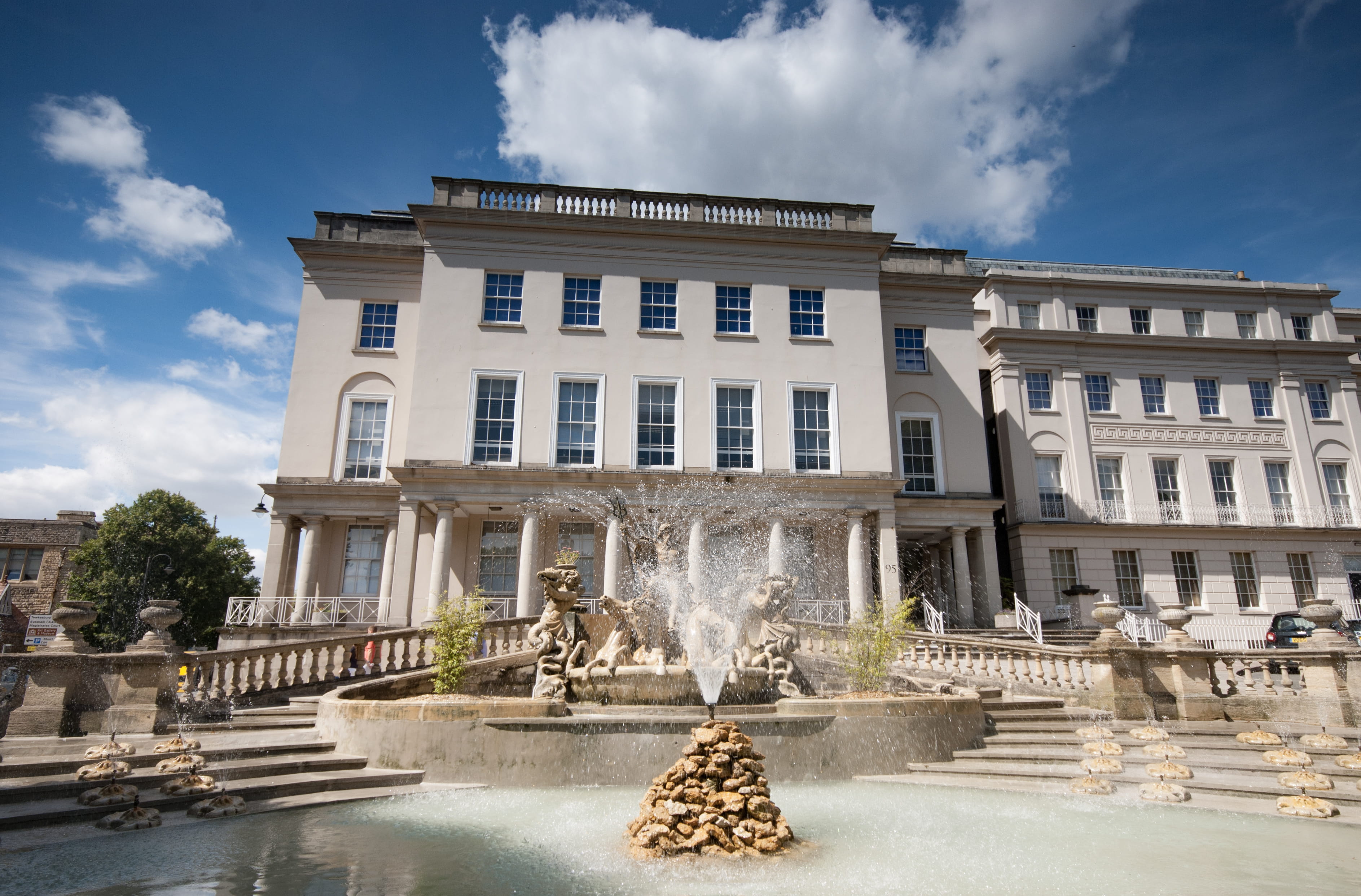 building exterior, outdoors, fountain, incidental people, building, cloud - sky, cheltenham, city, water, splashing, day, 2K, regency, sky, tree, architecture, HD Wallpaper