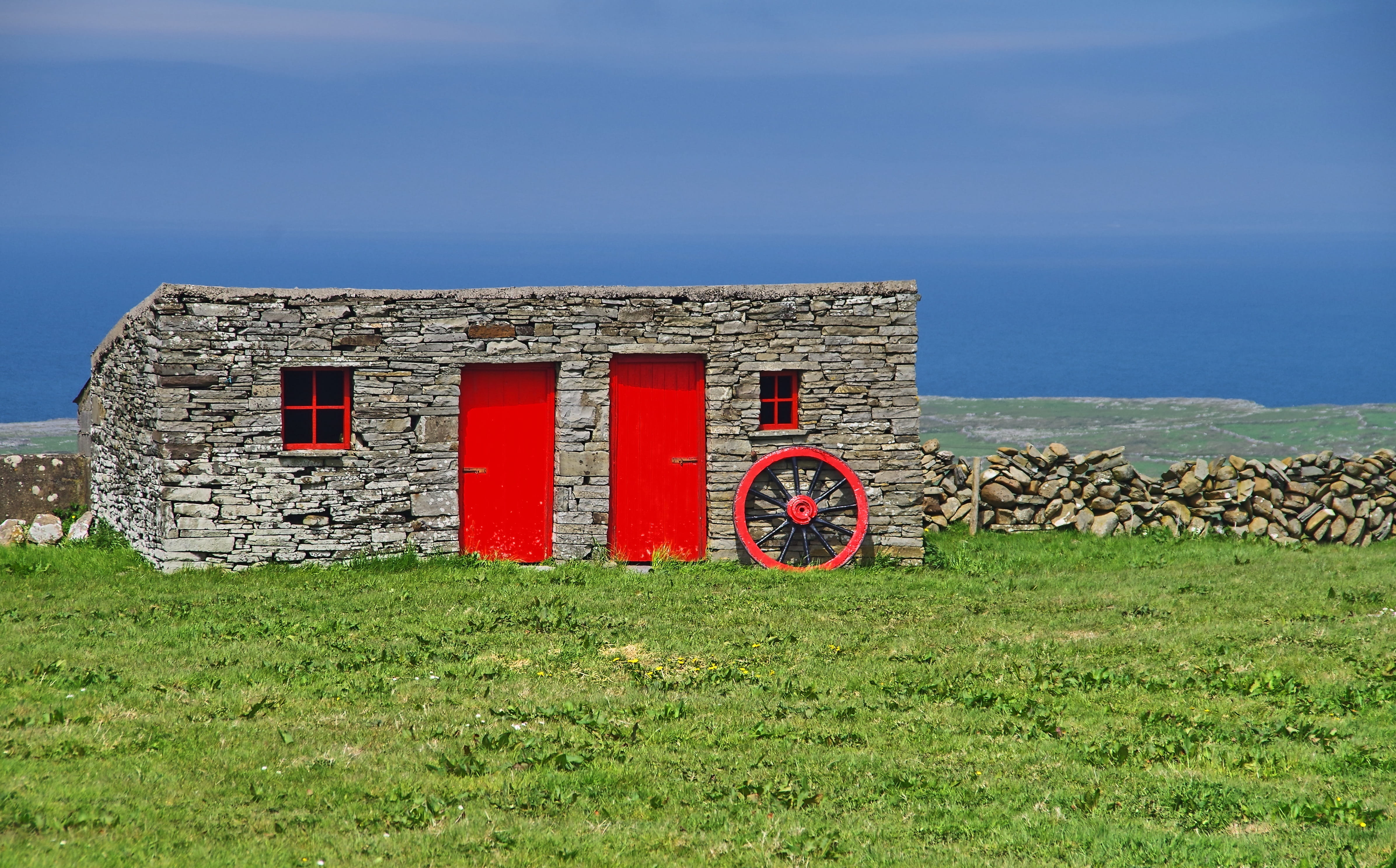 stone, outdoors, stone wall, grass, stone house, wheel, field, green, plant, no people, environment, clare, green color, land, blue, nature, architecture, HD Wallpaper