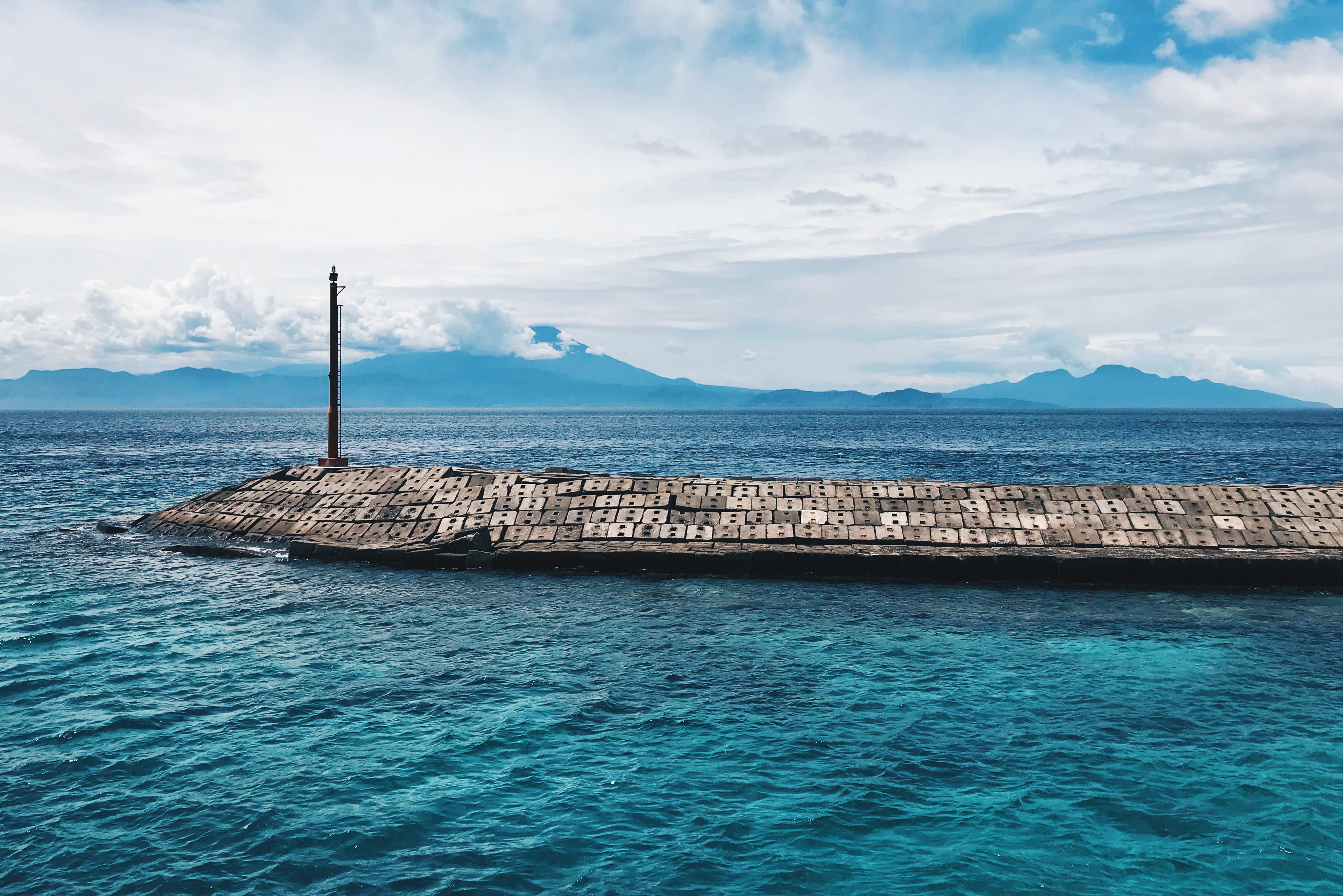 promontory, shoreline, groyne, solid, coast, land, white, kecamatan klungkung, beauty in nature, day, dock, cloud - sky, port, building, idyllic, tranquil scene, HD Wallpaper