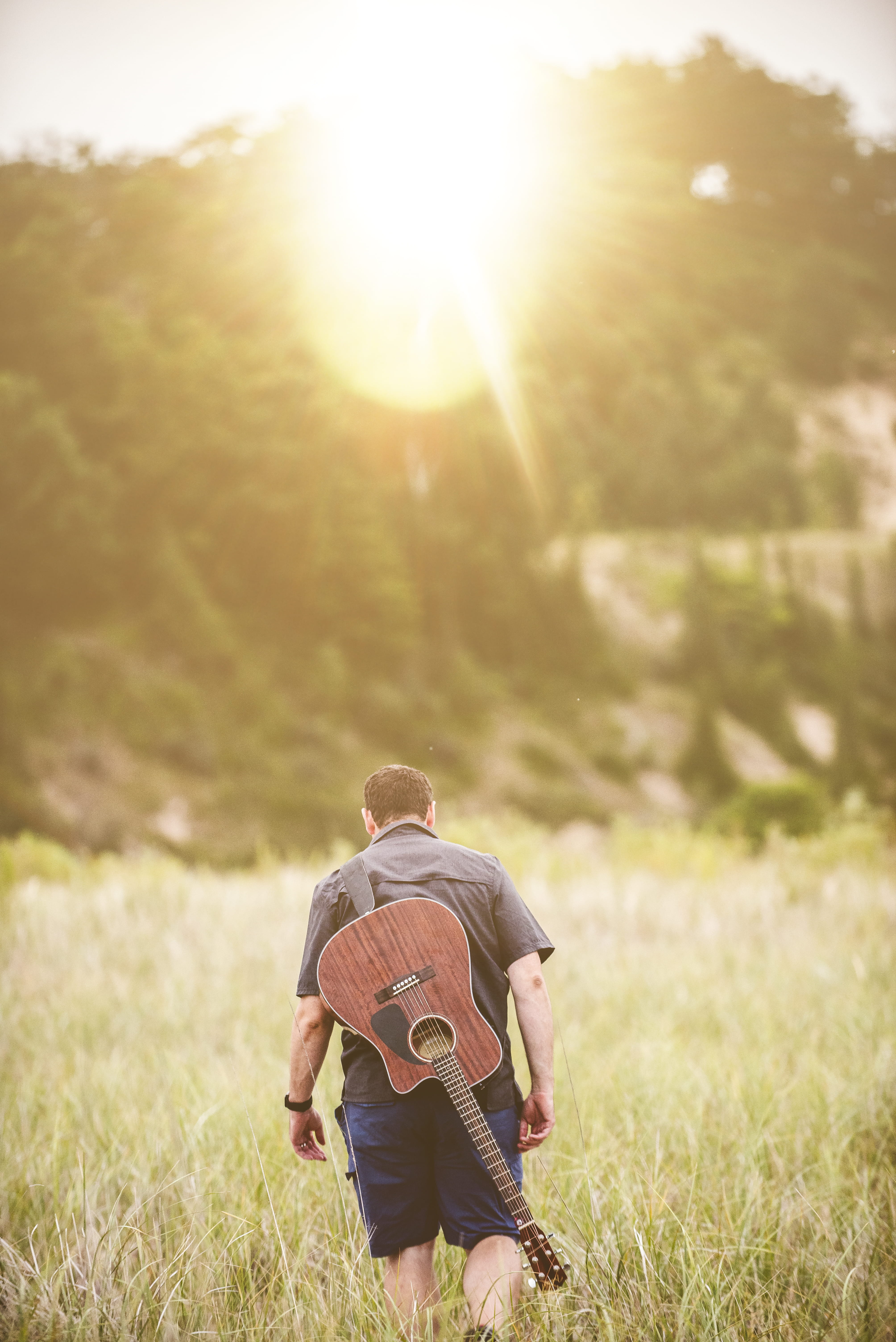 adult, adults Only, lifestyles, grass, summer, relaxation, sunset, bright, young Men, sun, day, one man only, happiness, growth, casual Clothing, males, Phone HD Wallpaper