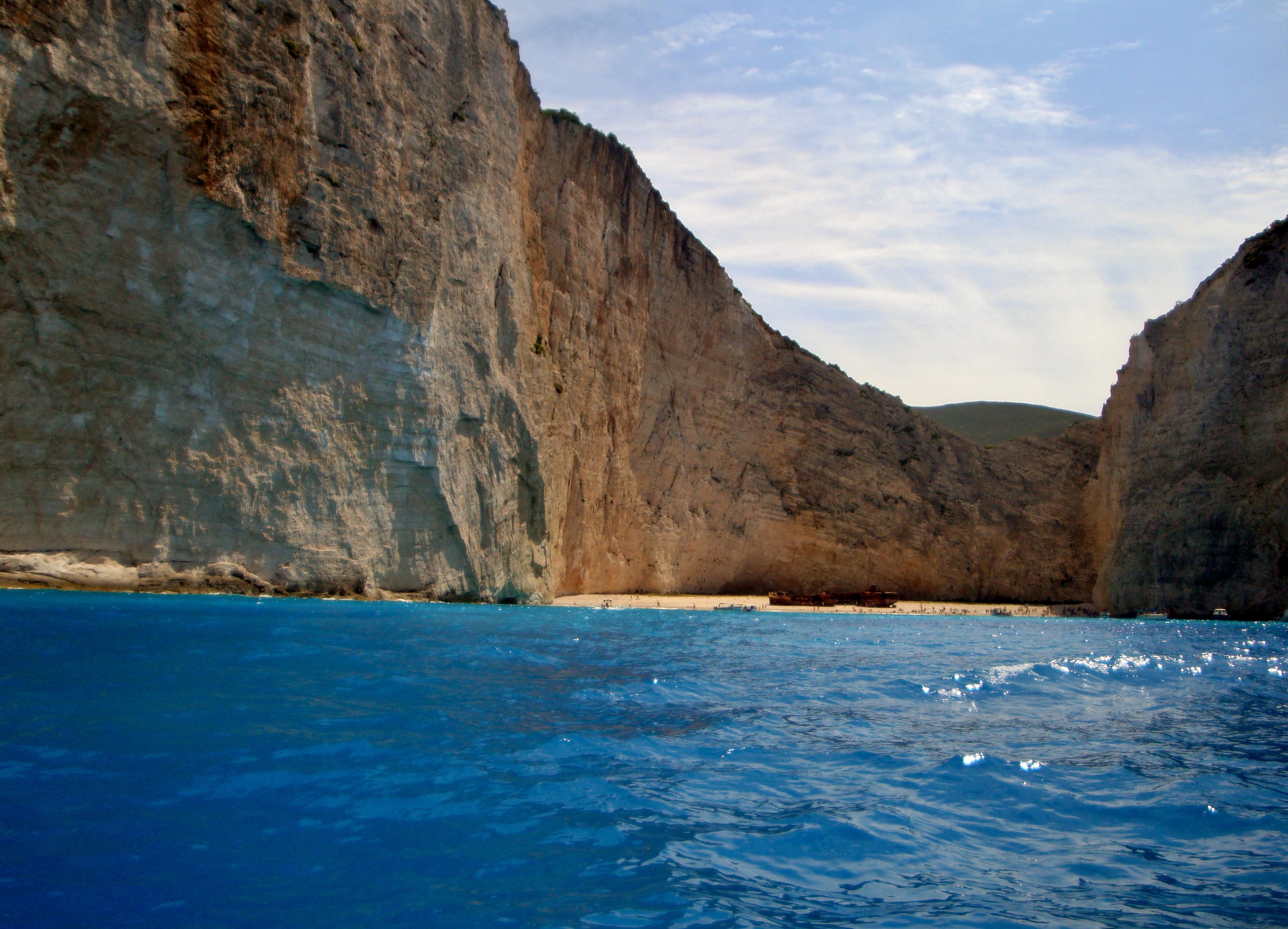 water, greece, island, rock formation, 2K, beach, rock - object, rocks, scenics - nature, mountain, summer, day, sky, no people, navagio beach, holidays, HD Wallpaper
