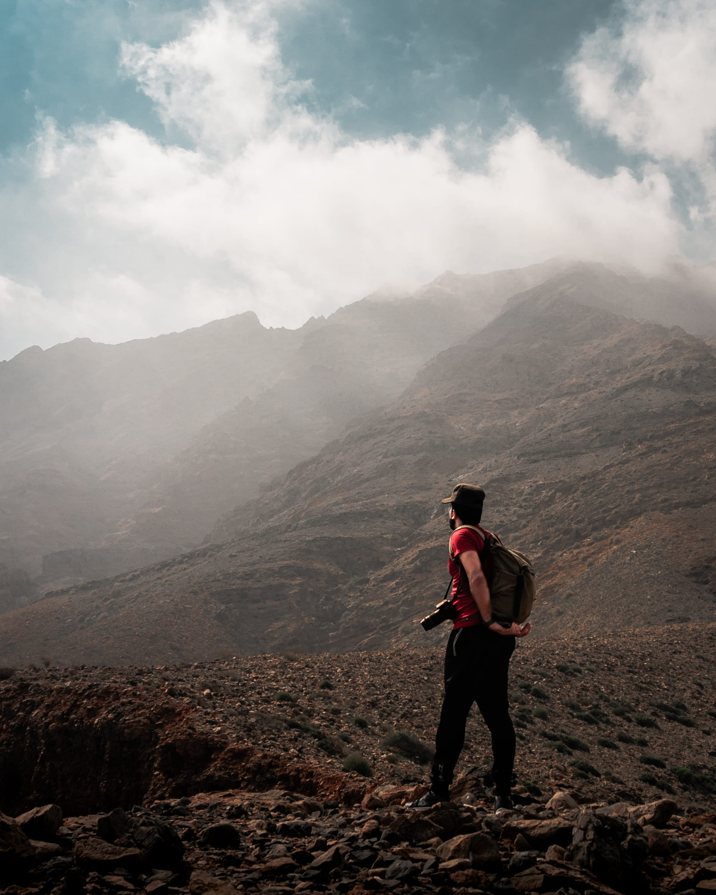 one person, clouds, person, sky, non-urban scene, 2K, oman, mountain, beauty in nature, full length, tranquility, human, outdoors, leisure activity, nature, Phone HD Wallpaper
