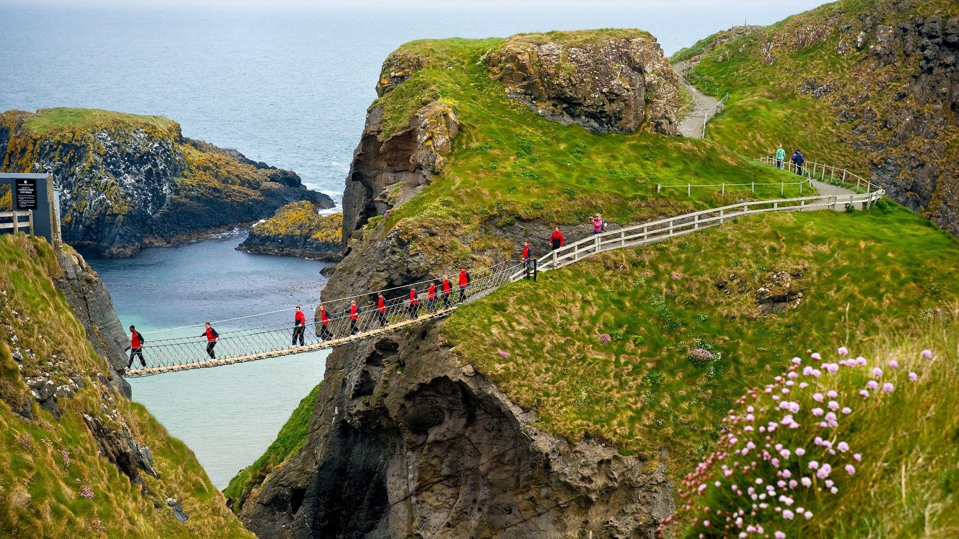 hanging, nature and landscapes, coastal, bridge, photo, men, photography, 1080P, coast, wearing, amazing, grass, hikers, red, walking, jacket, landscape, HD Wallpaper
