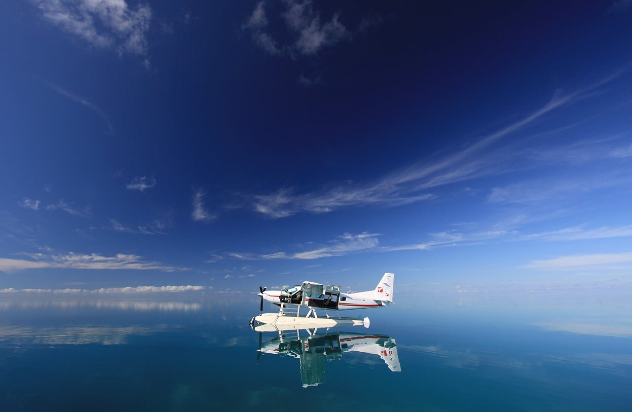 flying, tranquil scene, no people, scenics - nature, aircraft, water, waterfront, sky, air vehicle, tranquility, 480P, day, cloud - sky, white, mode of transportation, HD Wallpaper