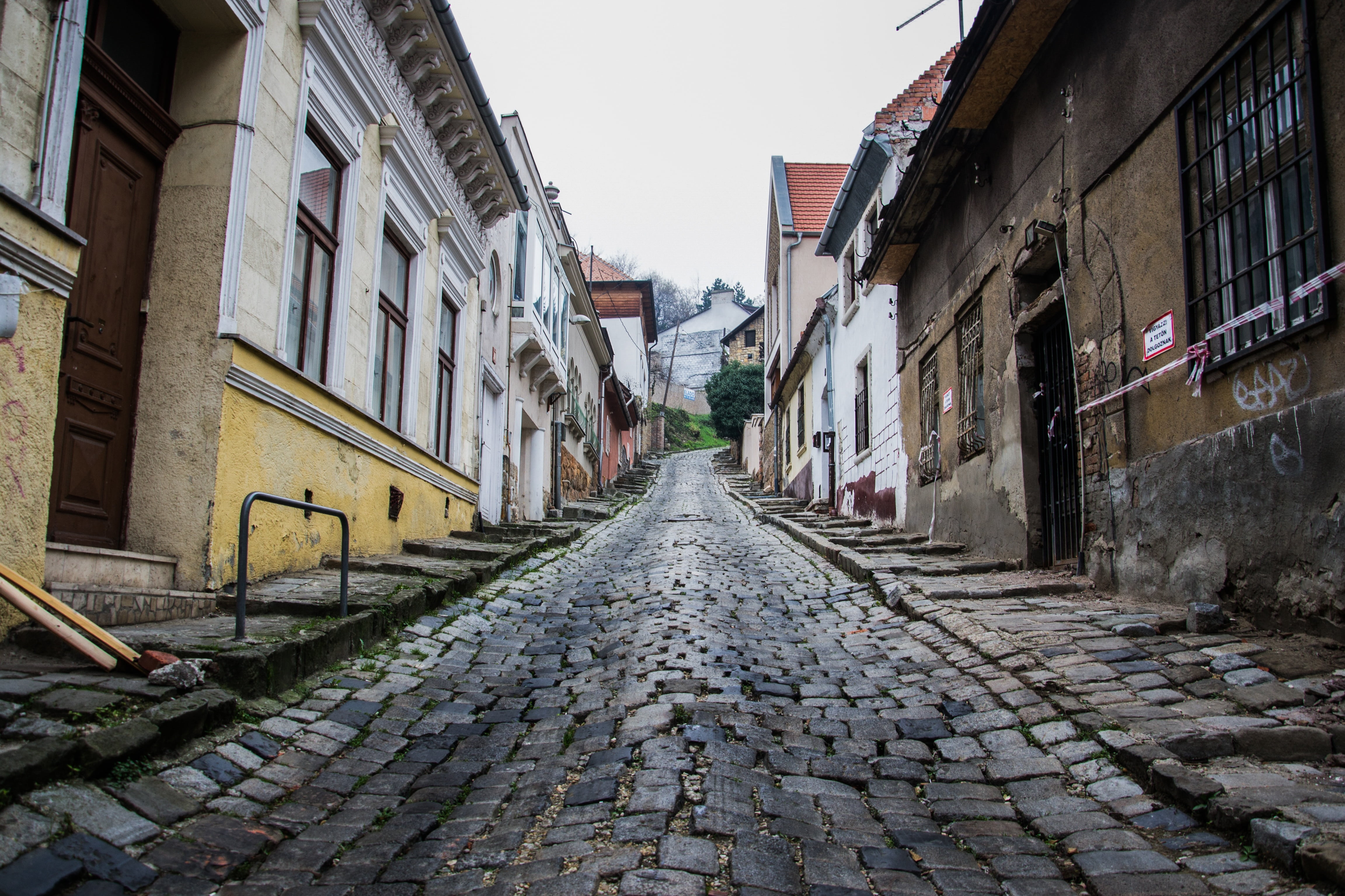 residential district, no people, historically, the way forward, sky, paving stone, cobblestone, brick, direction, narrow, 4K, road, europe, gray, day, HD Wallpaper