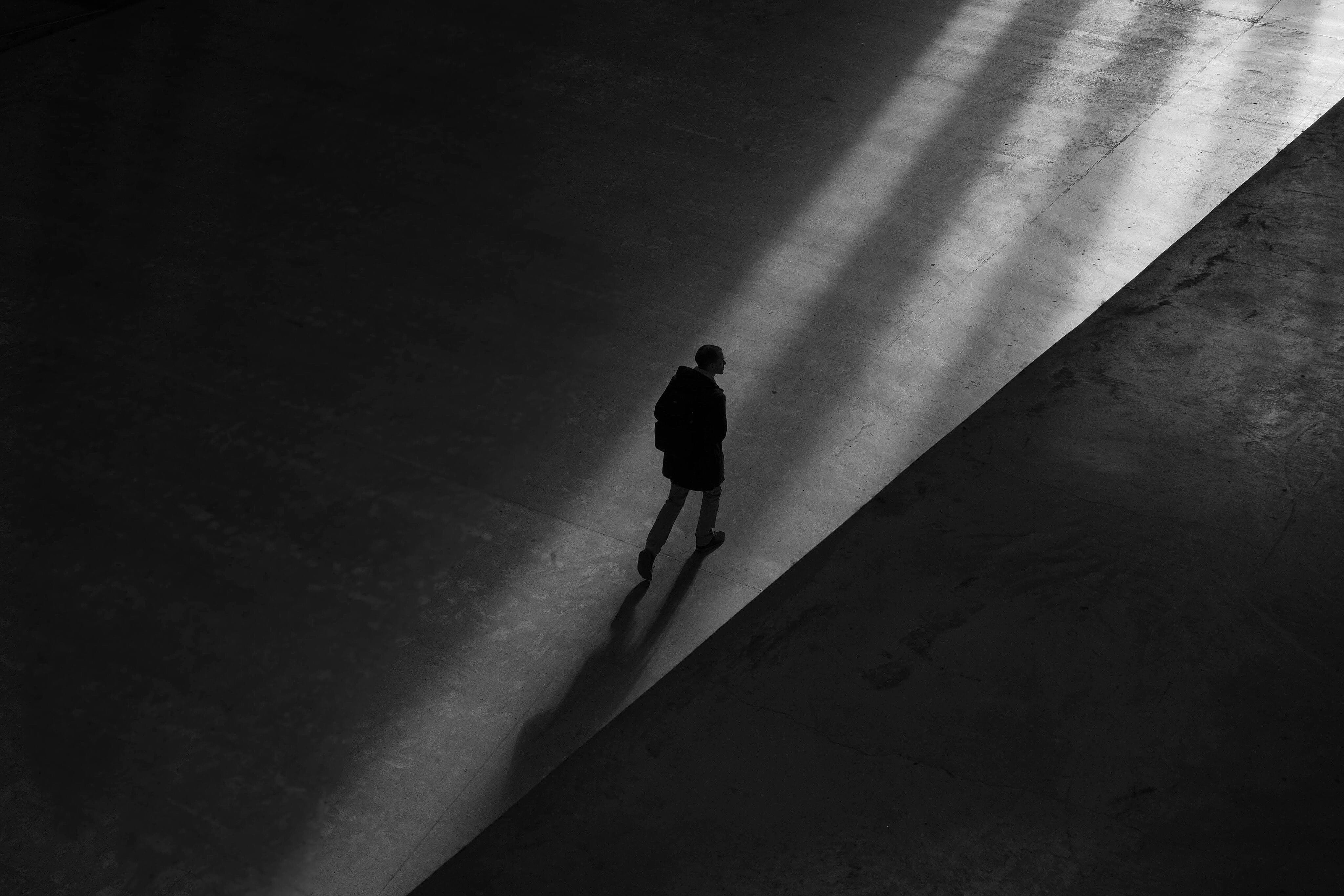 floor, silhouette, tunnel, day, walking, person, real people, pavement, leisure activity, black-and-white, mac, light at the end of the tunnel, HD Wallpaper