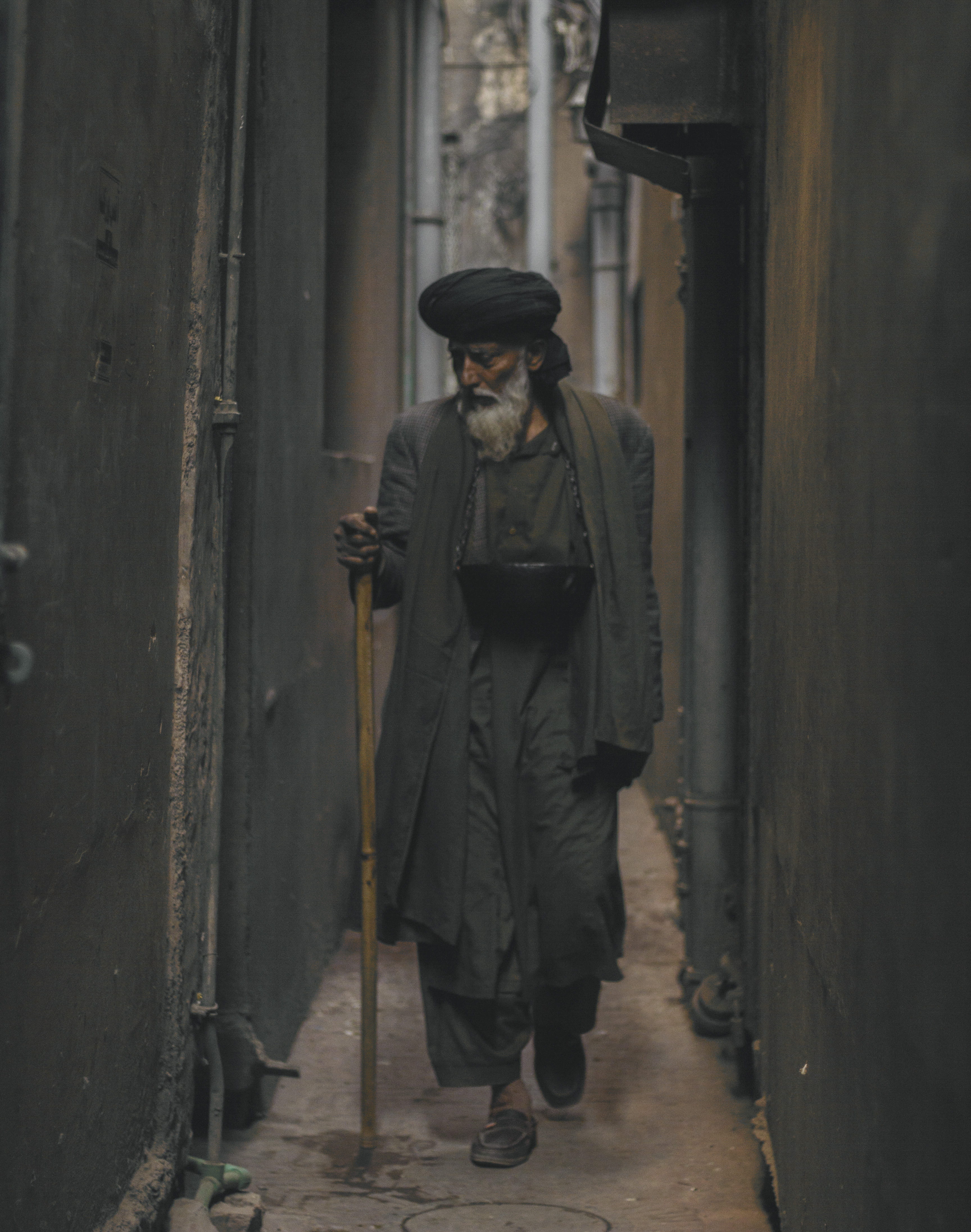 person, one person, coat, street, walking, standing, photo, old, architecture, alley, real people, government, warm clothing, looking, casual clothing, Phone HD Wallpaper