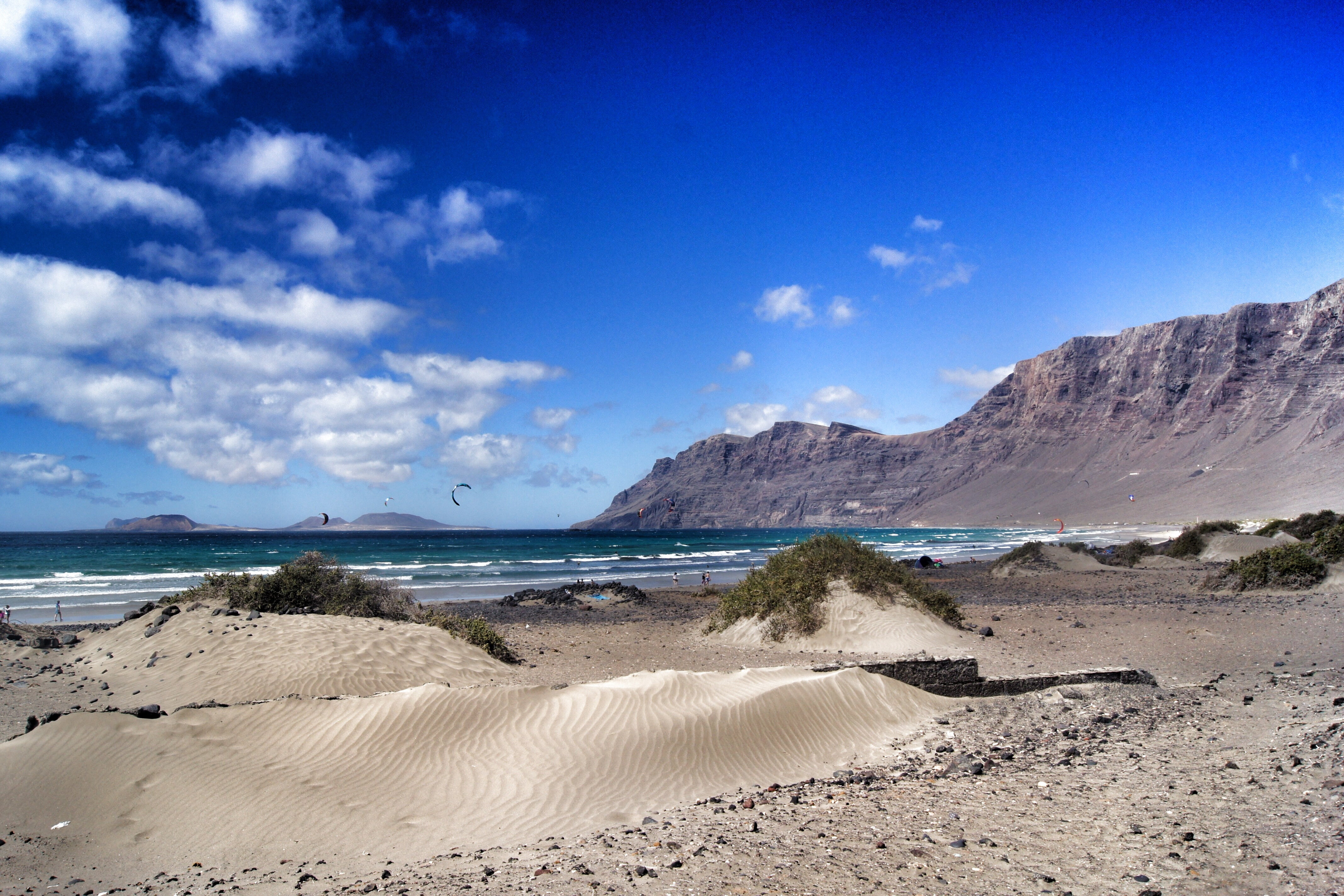 cloud - sky, environment, sand beach, sea, famara, nature, beach, scenics - nature, no people, mountains, rest, spain, tranquil scene, sky, water, photography, HD Wallpaper