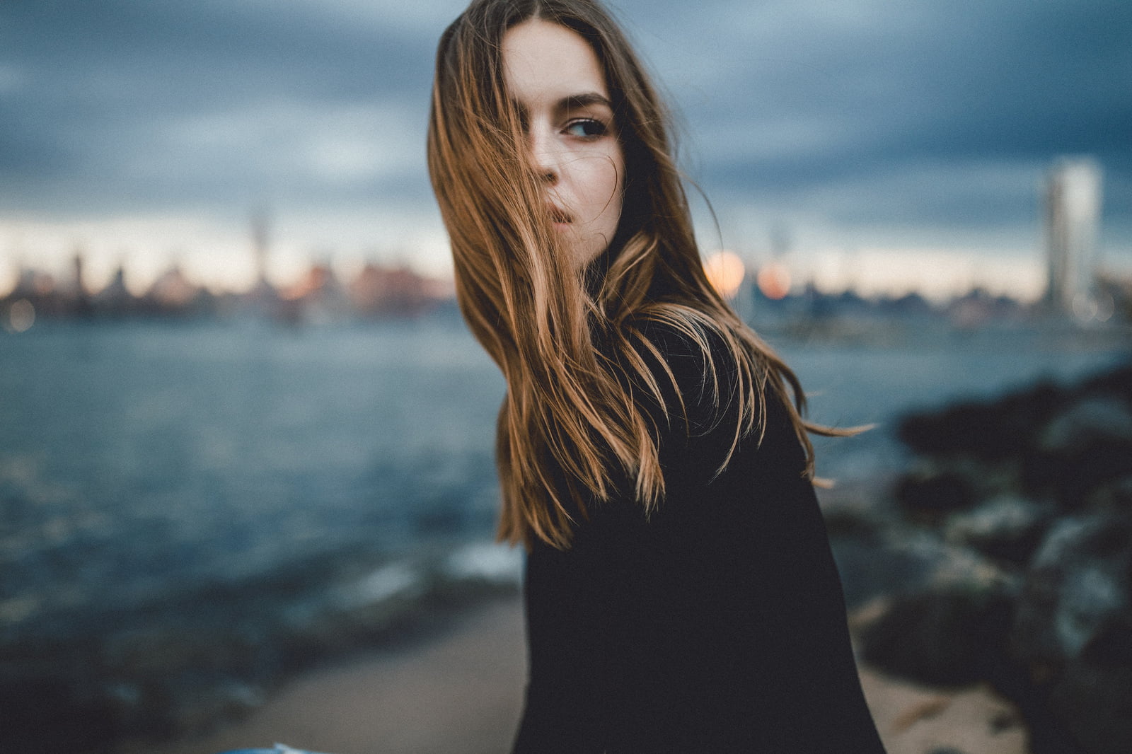 brunette, portrait, women, hair in face, Caitlin Nusche, 720P, young women, sky, one person, hair, young adult, SamAlive, looking, focus on foreground, HD Wallpaper