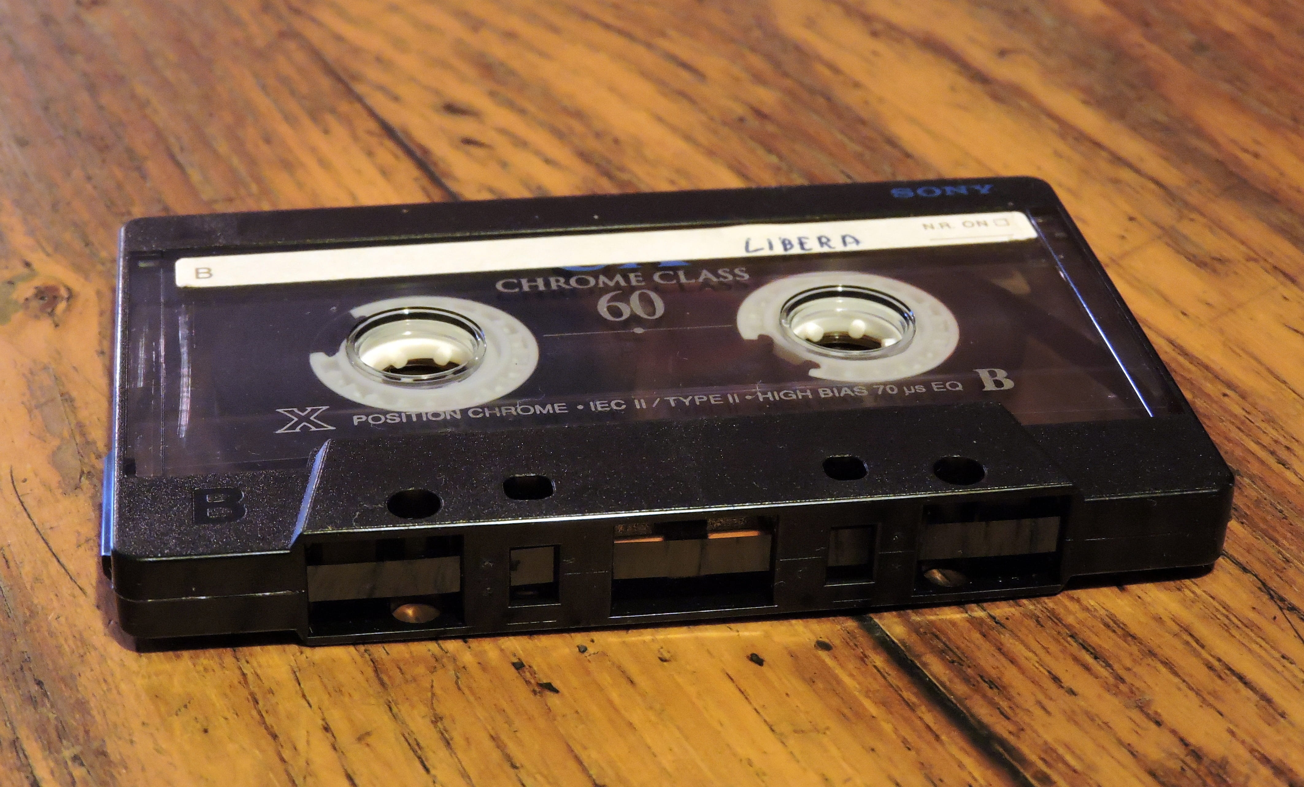 electrical equipment, close-up, 4K, Musicassette, indoors, camera - photographic equipment, single object, tape, music, old, black, radio, magnetic tape, HD Wallpaper