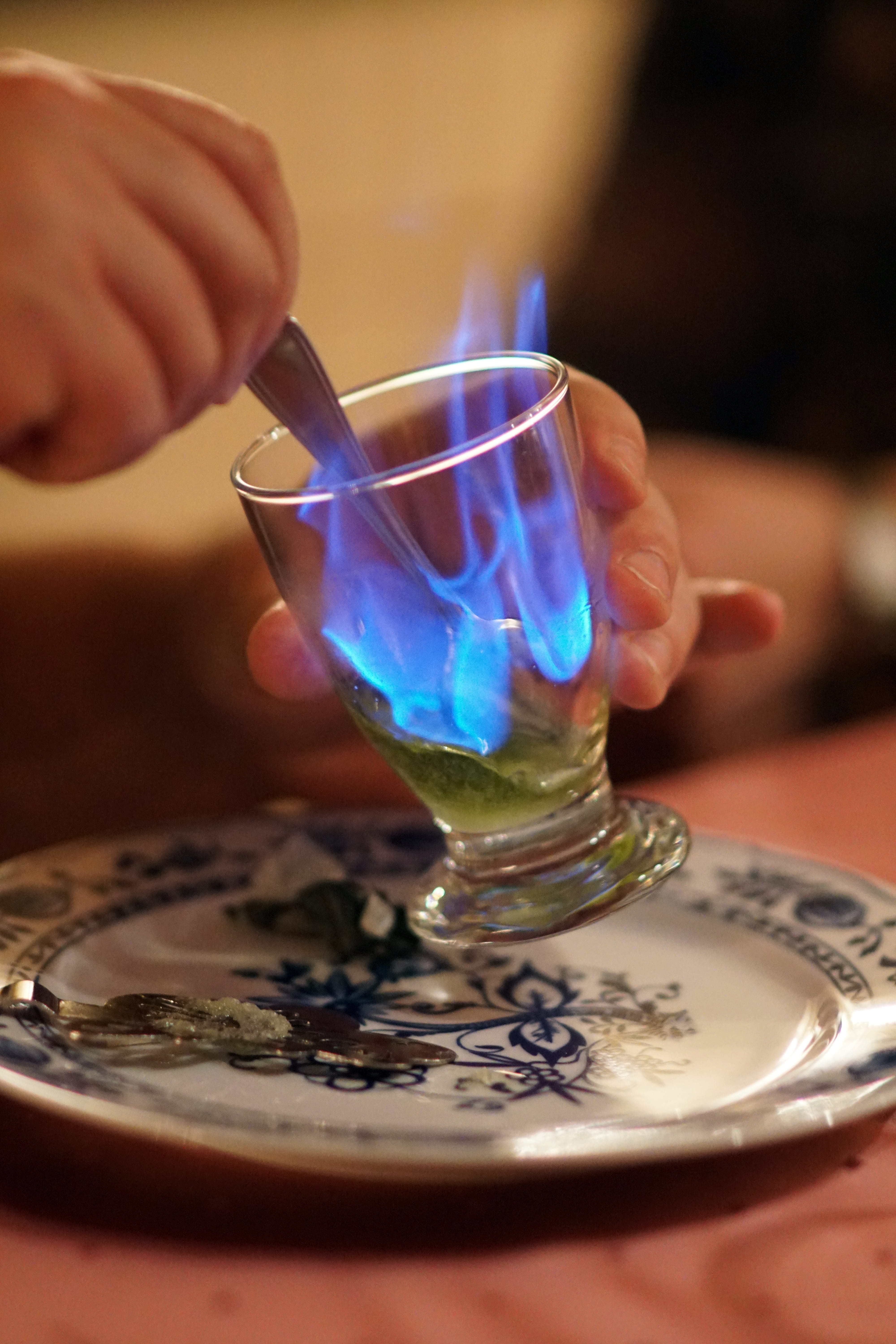 close-up, refreshment, blue flame, drink, holding, 5K, Drink, hand, human body part, glass, real people, human hand, people, finger, Absinthe, alcohol, Phone HD Wallpaper