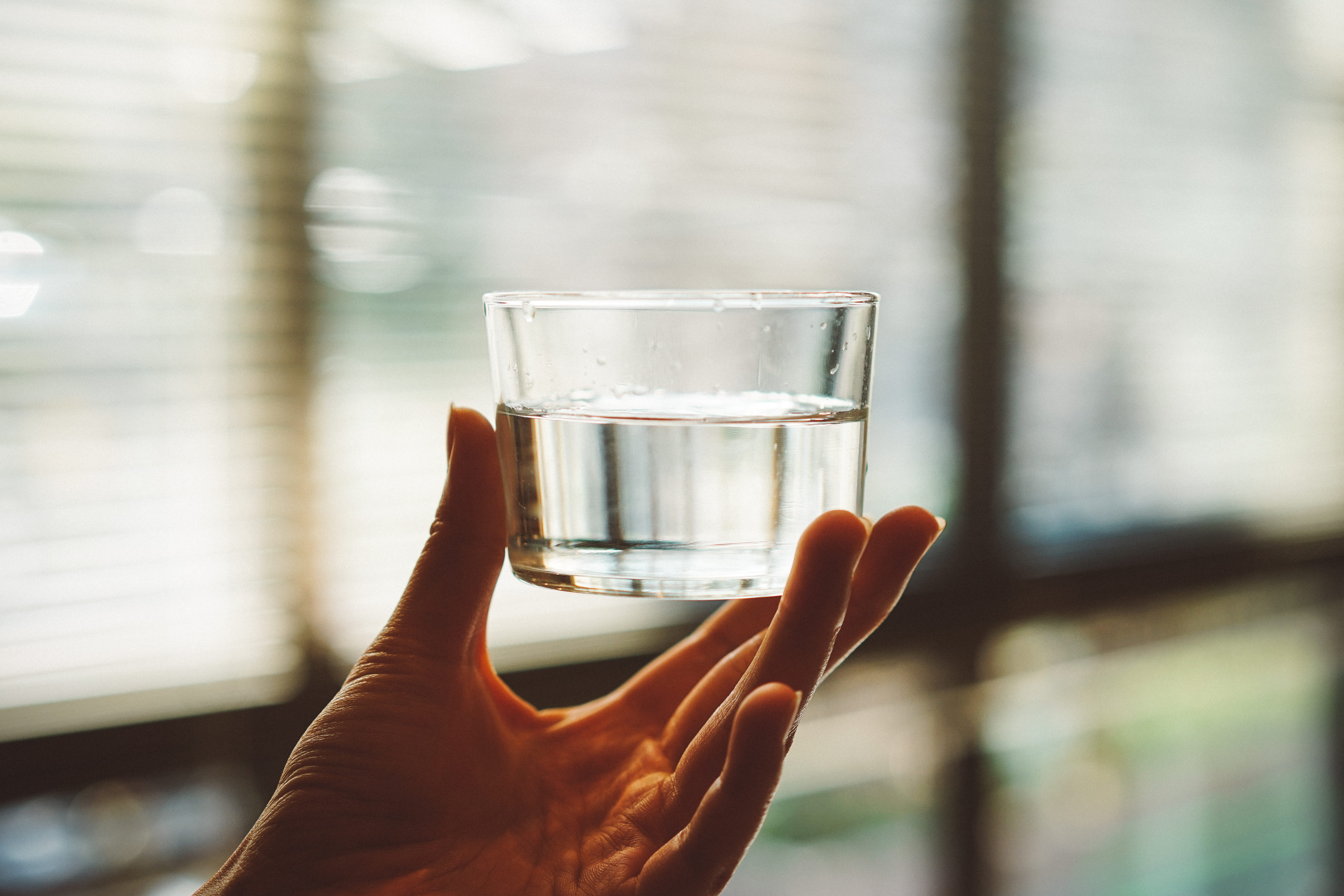 drinking glass, water, human finger, drink, japan, refreshment, glass, clear, beer glass, finger, 5K, focus on foreground, one person, household equipment, HD Wallpaper