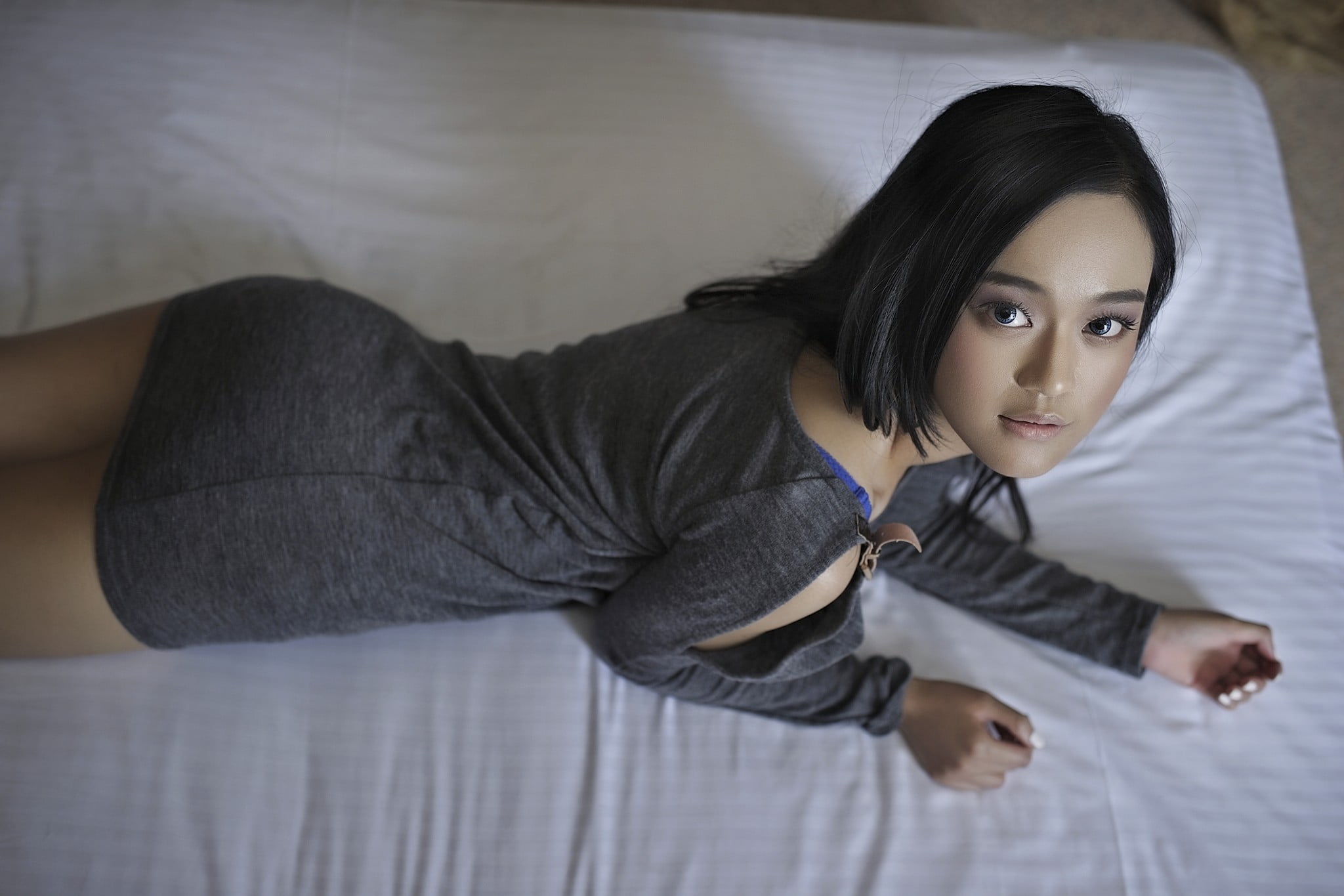 looking at camera, fake iris, leisure activity, long eyelashes, relaxation, women, gray dress, black hair, Asian, three quarter length, real people, portrait, HD Wallpaper