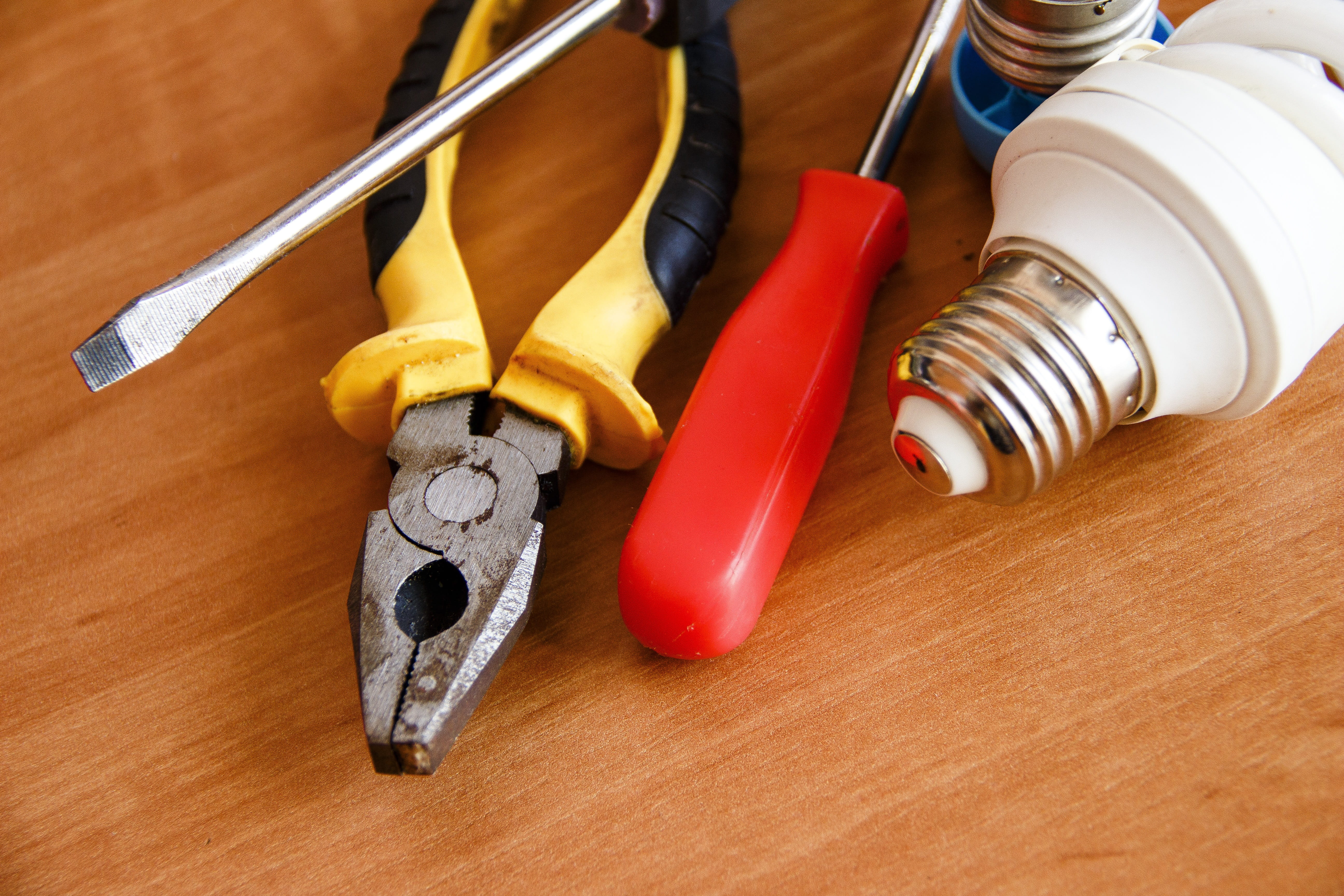 5K, electrician, electric, table, high angle view, repair, group, indoors, group of objects, hand tool, security, pliers, wood - material, no people, red, HD Wallpaper