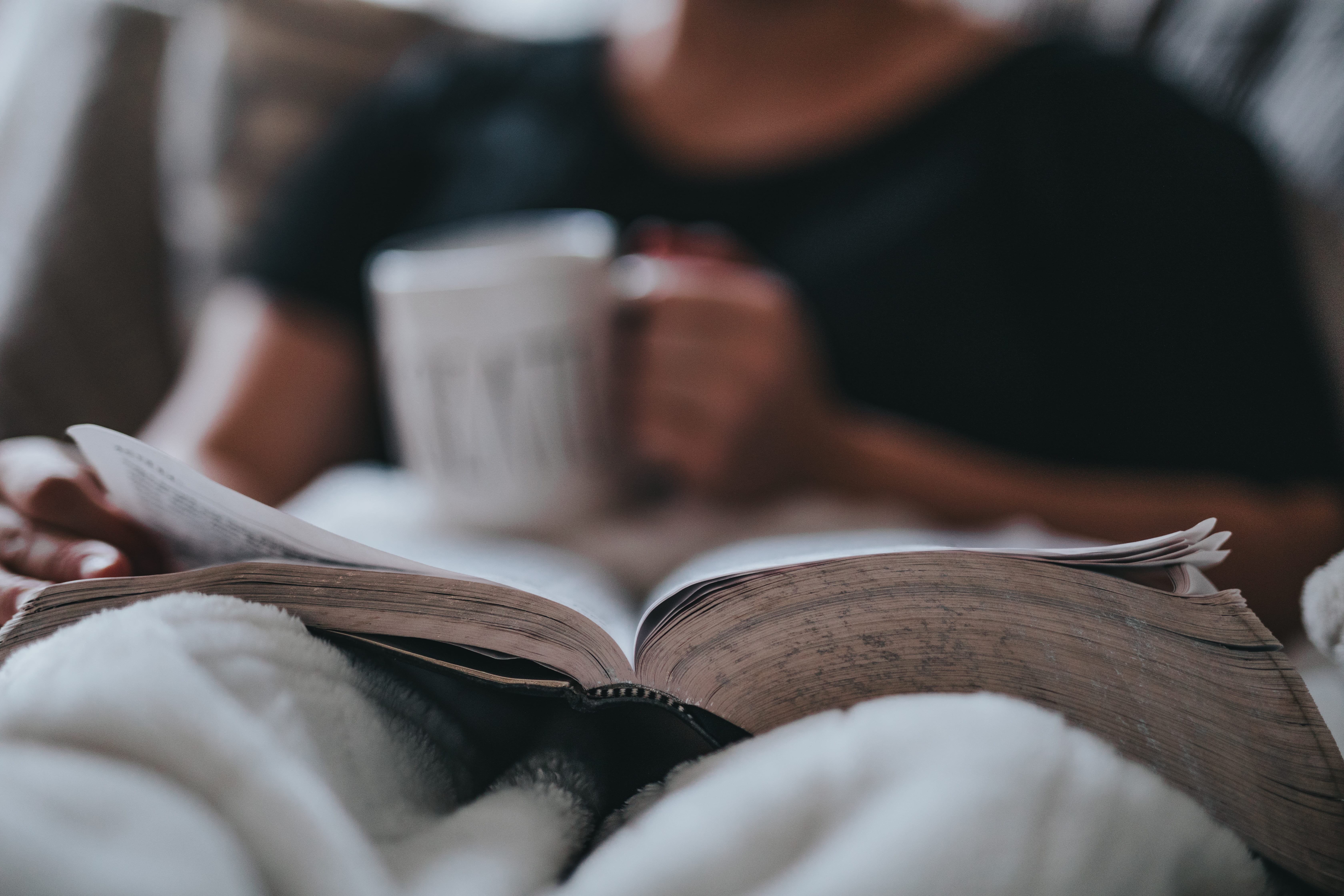 young adult, studying, relaxation, indoors, one person, white, mug, coffee, adult, 5K, book, sitting, midsection, paper, reading, learning, publication, HD Wallpaper