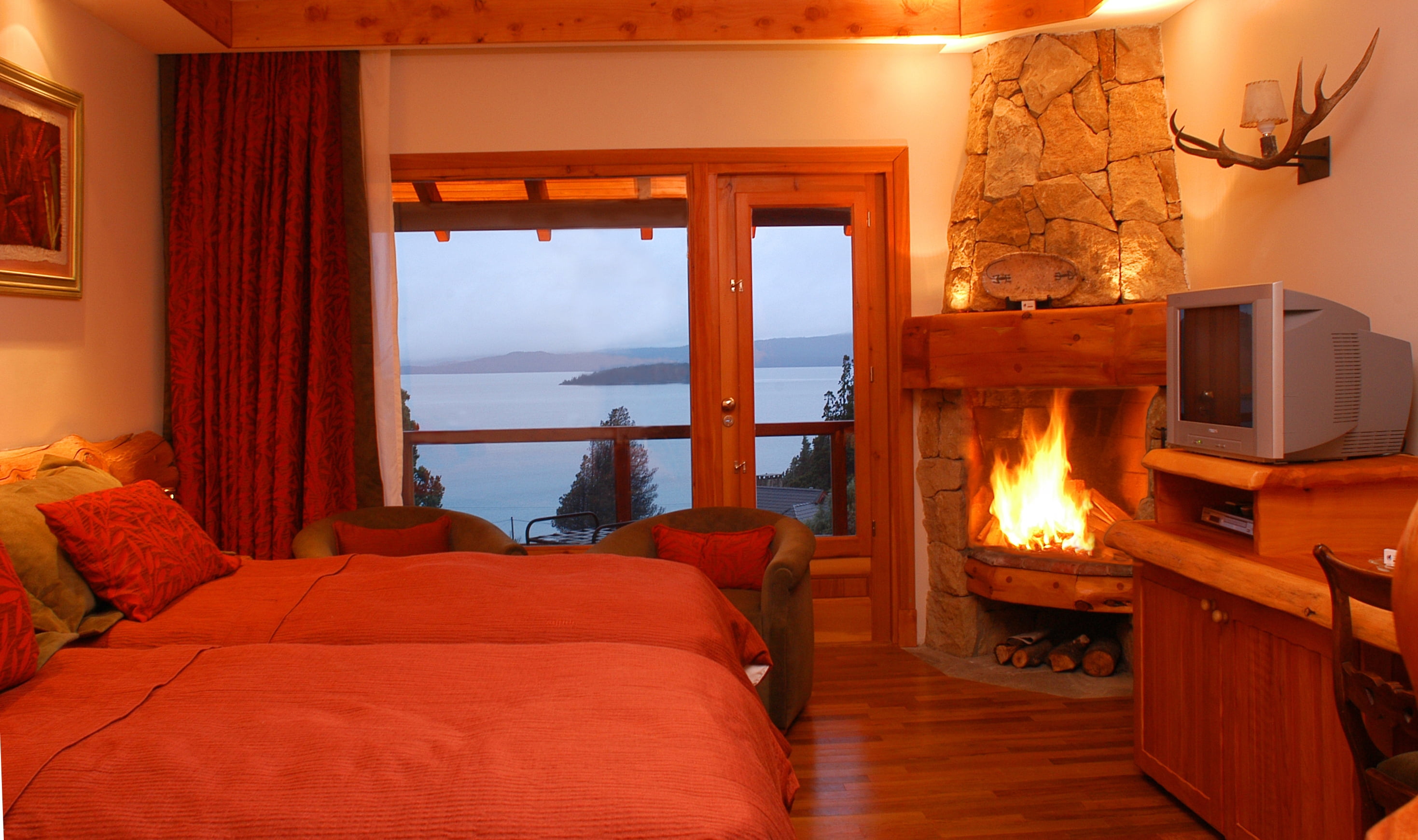 fireplace, chair, hotel, elegance, style, comfortable, flooring, lighting Equipment, relaxation, hotel Room, fire, pillows, residential Building, vacations, HD Wallpaper