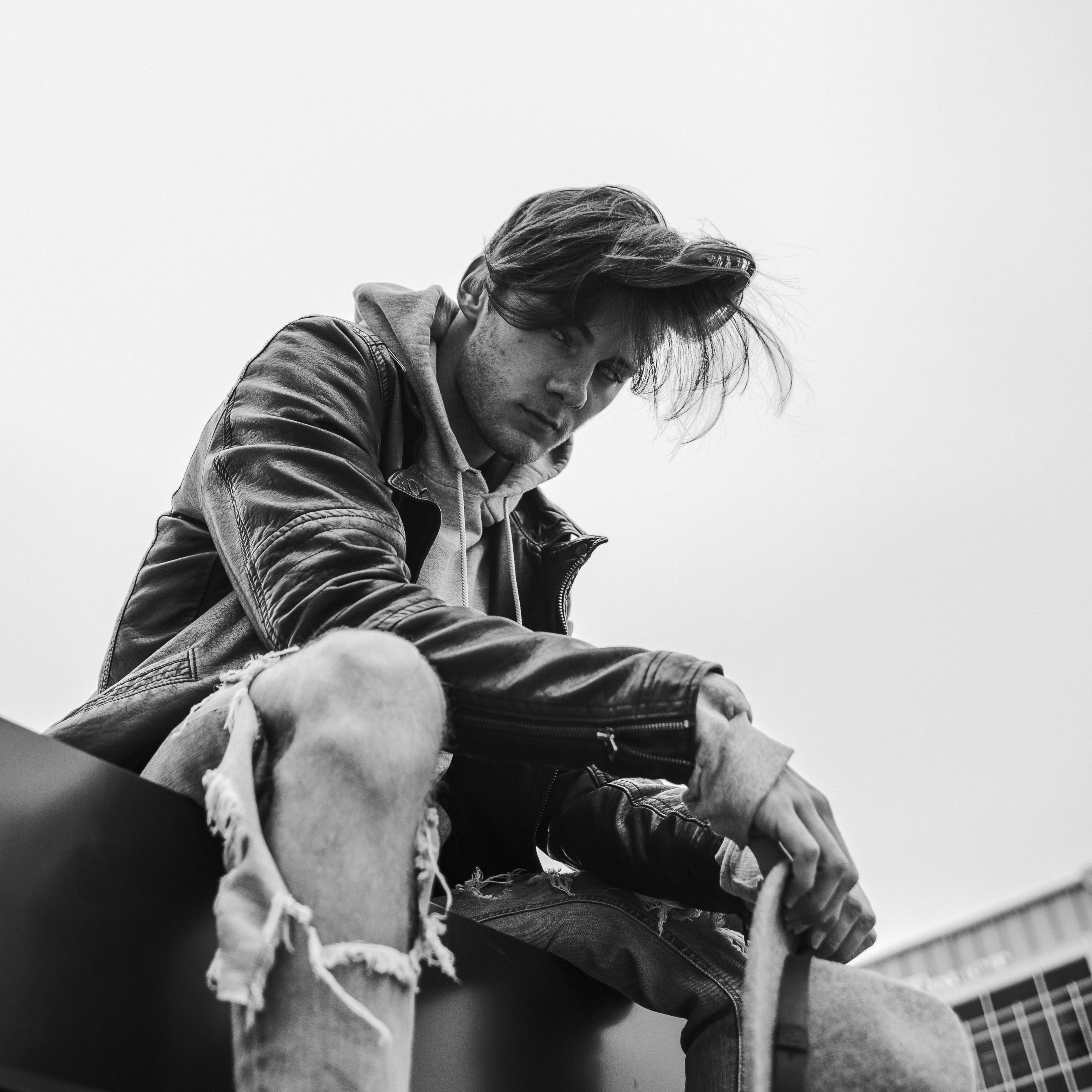 clear sky, building, males, wearing, jacket, sit, adults only, caucasian, 2K, photography, day, photo, adult, near, horse, real people, floor, grayscale, Phone HD Wallpaper