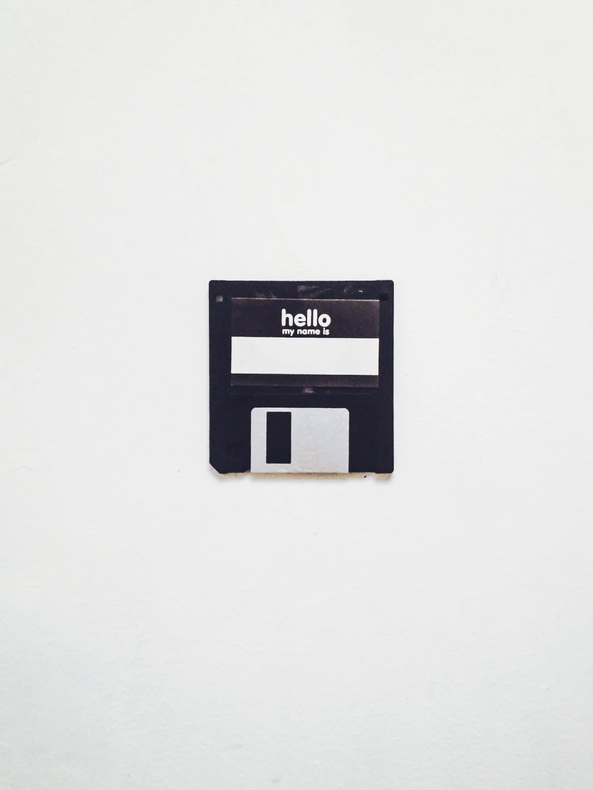 wall - building feature, letter, retro, black color, communication, power supply, white background, floppy disk, 2K, electricity, no people, sign, white color, Phone HD Wallpaper