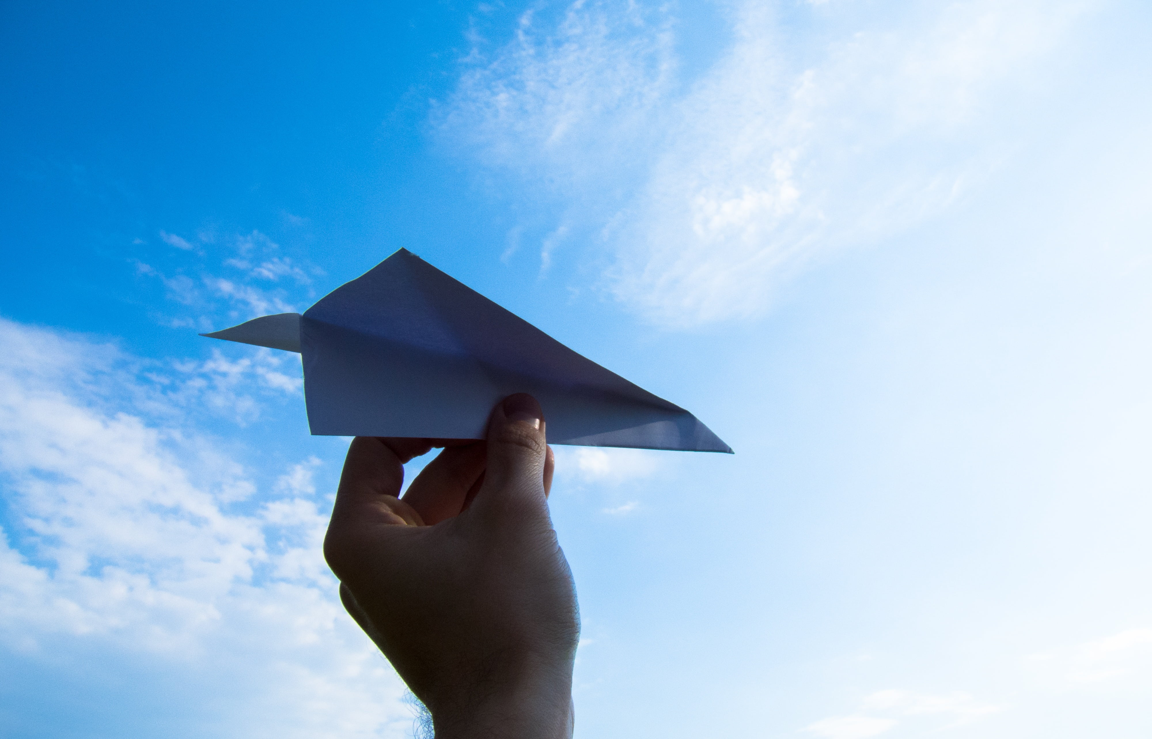human hand, human arm, holding, sunlight, human limb, sky, cloud - sky, clouds, the plane, outdoors, day, man, paper Airplane, throw, diploma, education, HD Wallpaper