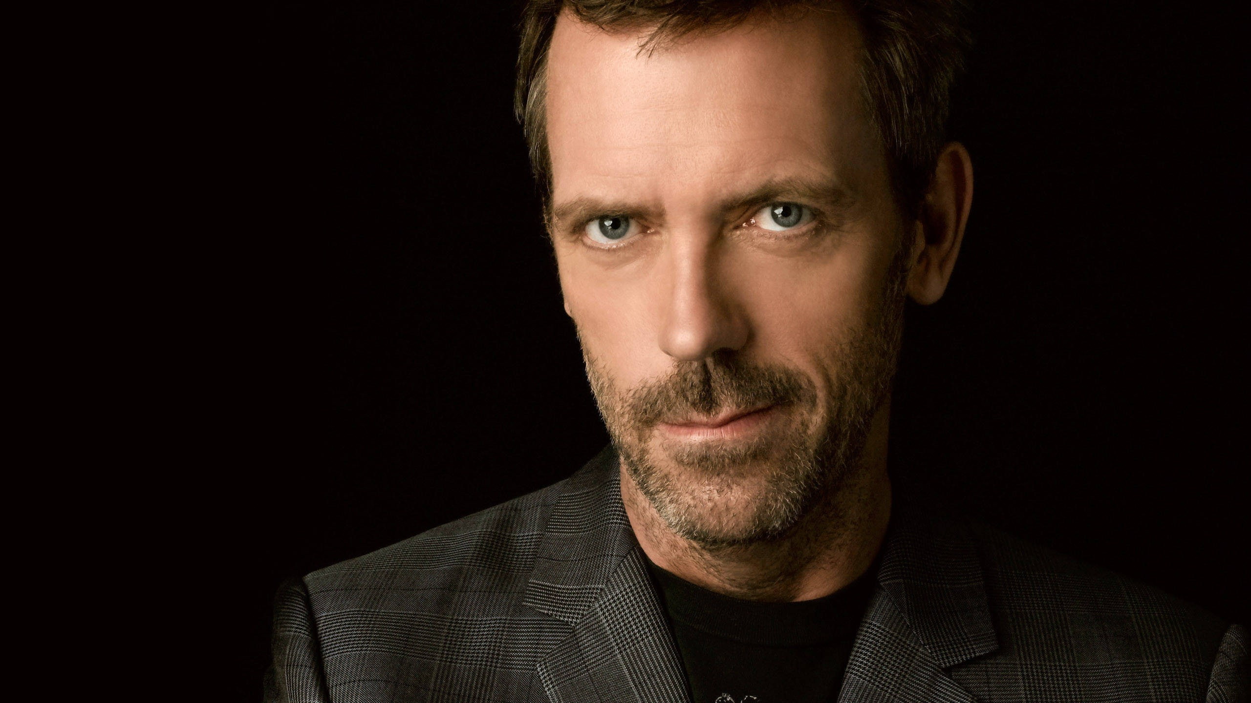 mid adult, beautiful people, 2K, Hugh Laurie, dark, black background, portrait, looking at camera, one person, handsome, contemplation, adult, headshot, HD Wallpaper