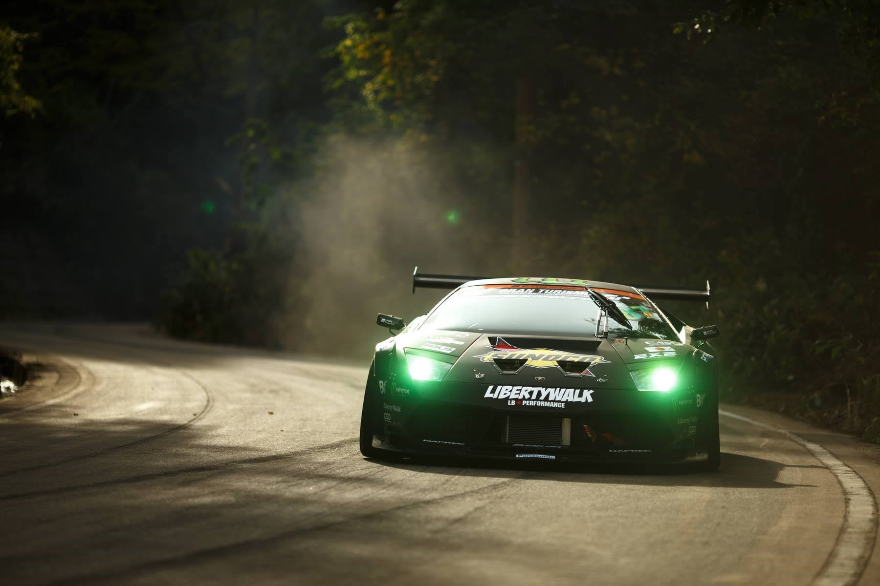 tree, head lights, street, motor vehicle, sports, sports car, green, motion, Lamborghini, sunlight, transportation, communication, city, speed, forest, HD Wallpaper