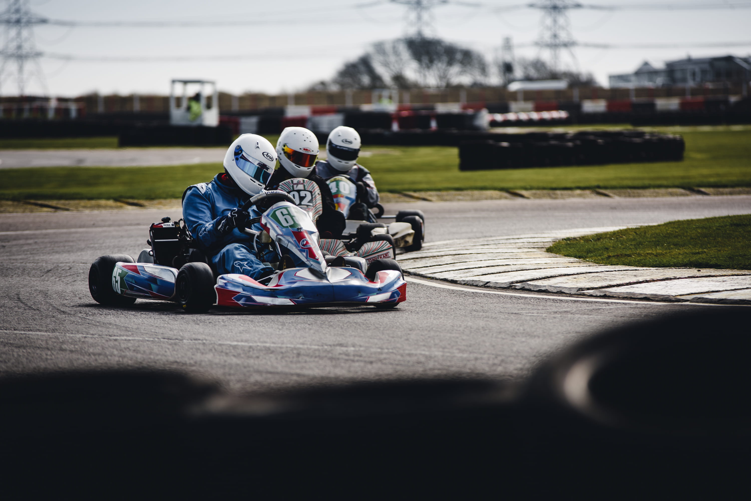 drive, motorsport, 2K, sports helmet, crash helmet, people, track and field, helmet, karts, outdoors, circle, championship, motion, tournament, motor racing, HD Wallpaper