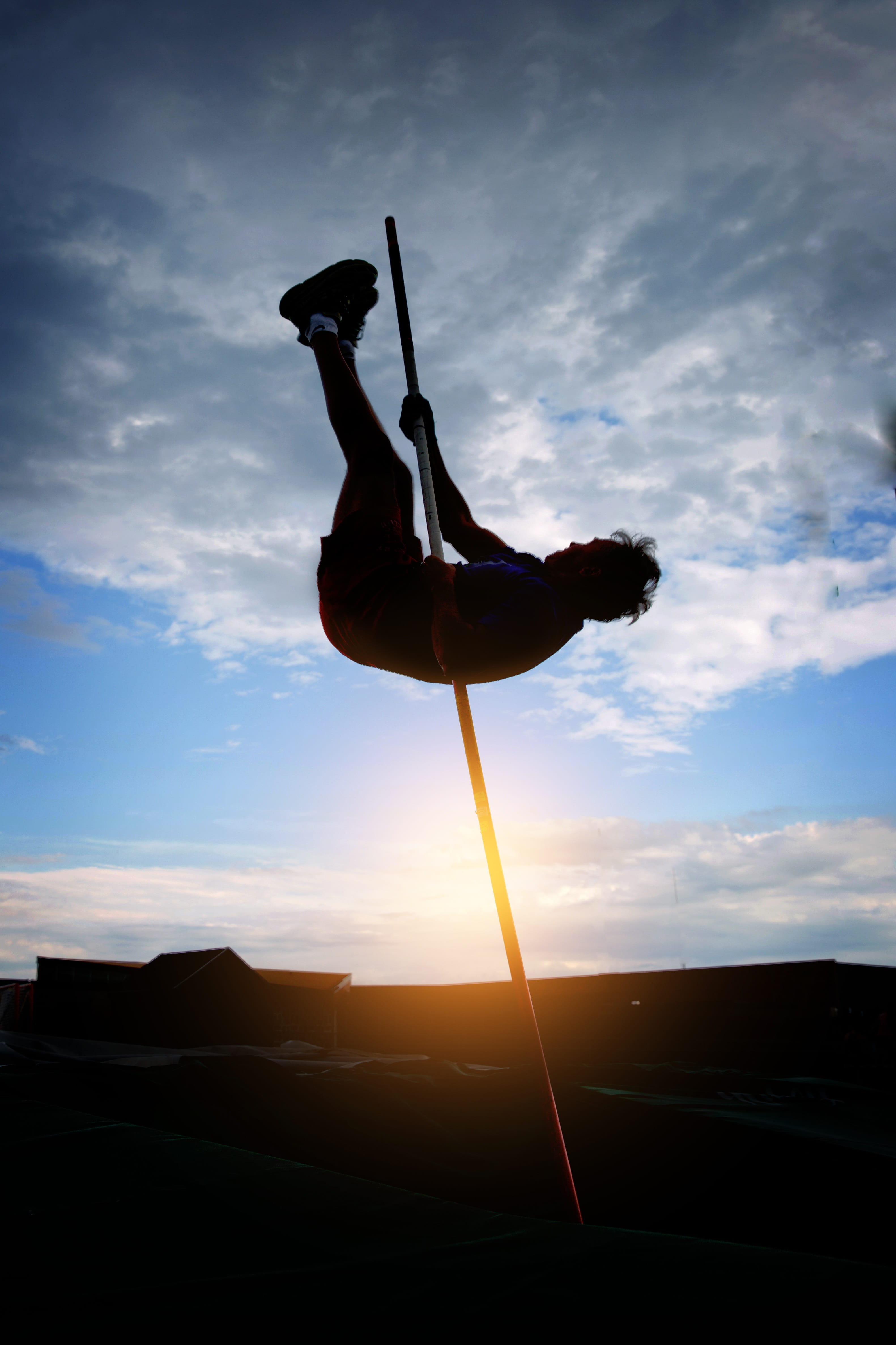 lifestyles, beauty in nature, orange color, strength, real people, silhouette, vaulting, balance, low angle view, sunlight, success, pole vault, training, Phone HD Wallpaper