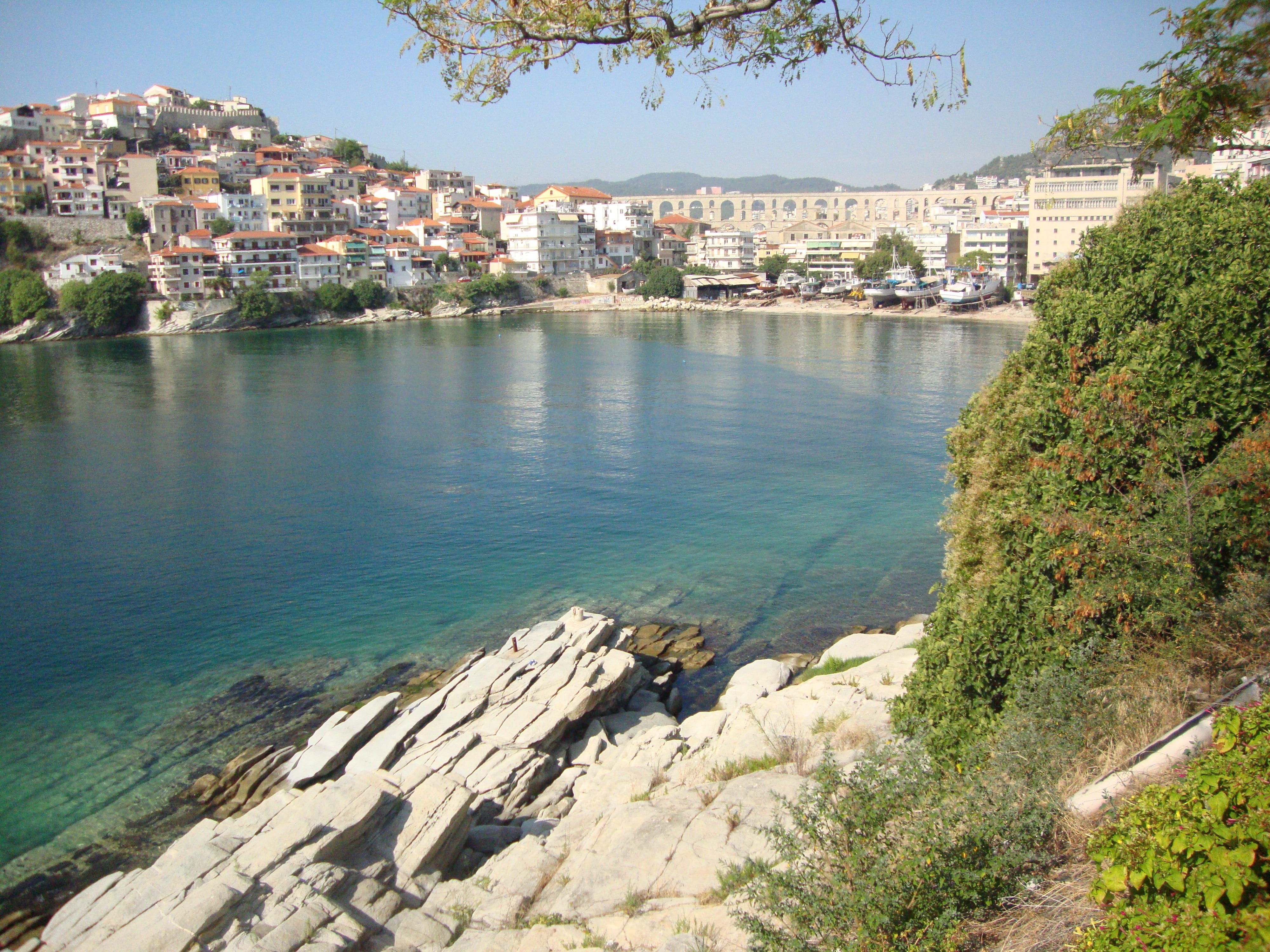 rocks, city, town, plant, greece, kavala, cityscape, building exterior, residential district, 4K, outdoors, sunlight, water, nature, townscape, architecture, HD Wallpaper