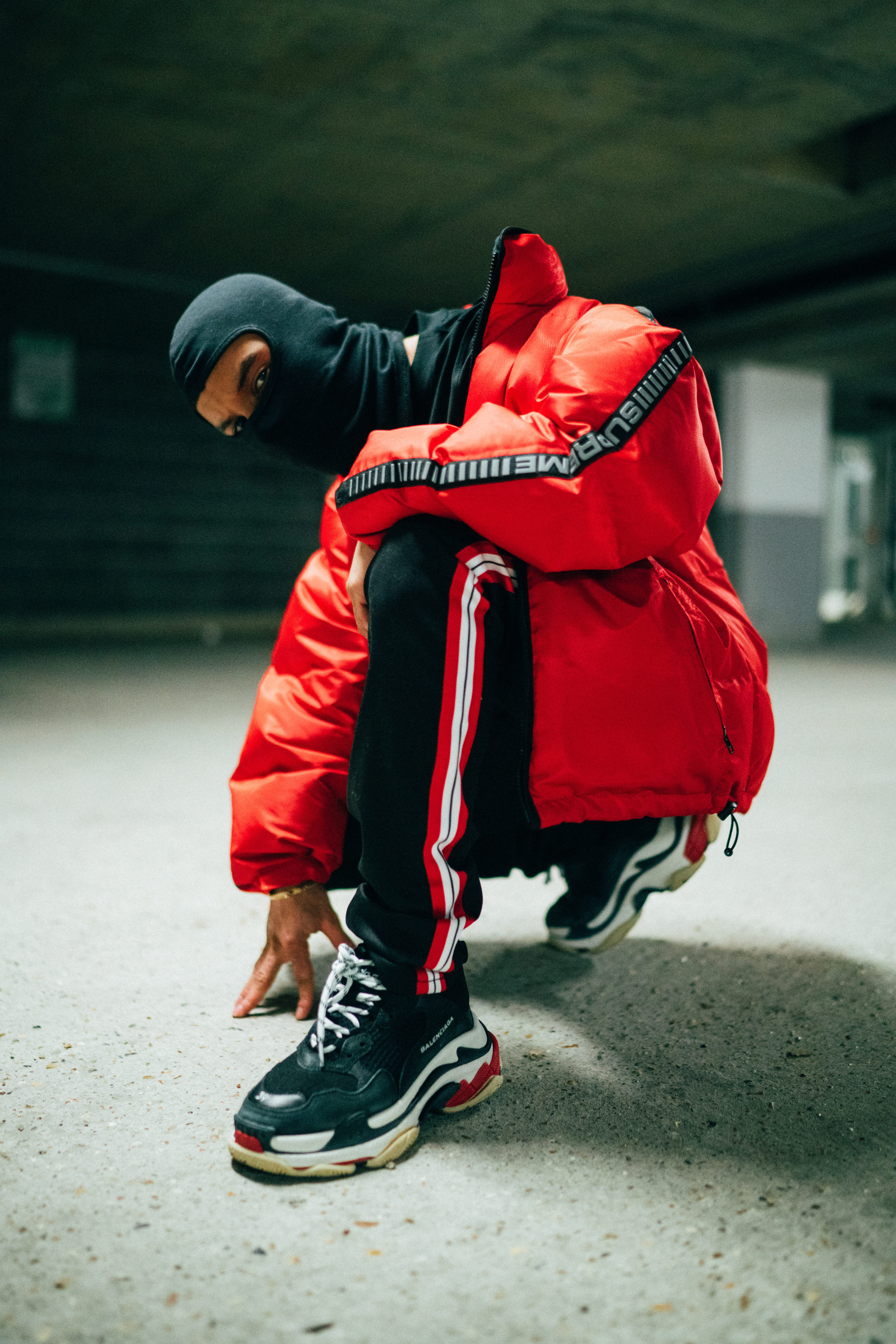 sitting, floor, clothing, women, real people, outdoors, street style, kneeling, looking, one person, leisure activity, balaclava, shoe, full length, dancing, Phone HD Wallpaper
